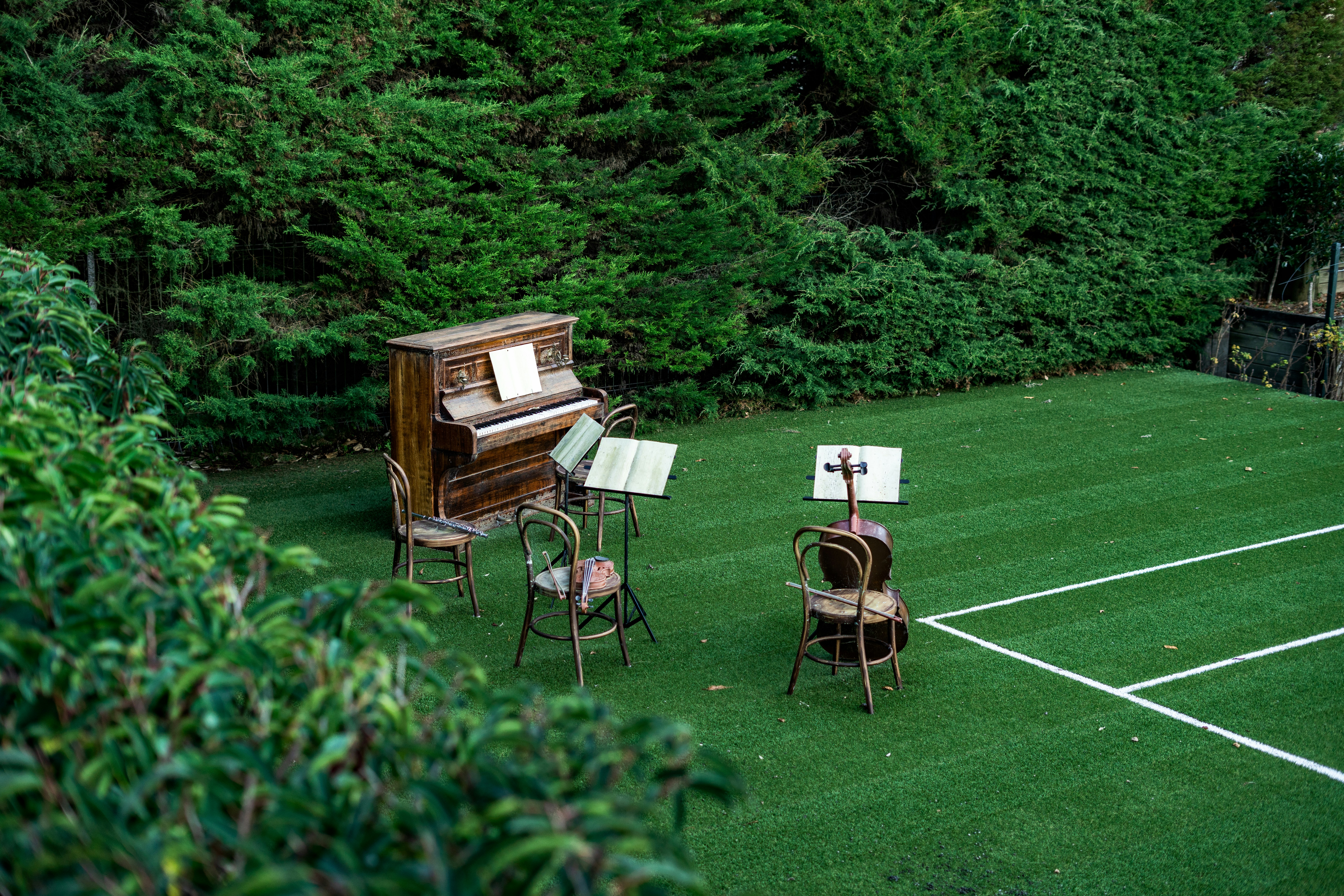 Music instruments are set up on a green field.