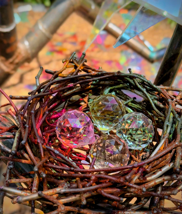 Glass ornaments resting in a nest of woven branches