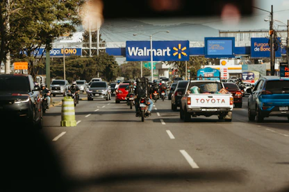 Busy road traffic passes a walmart store