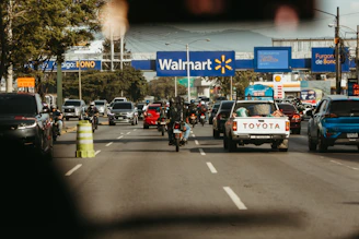 Busy road traffic passes a walmart store