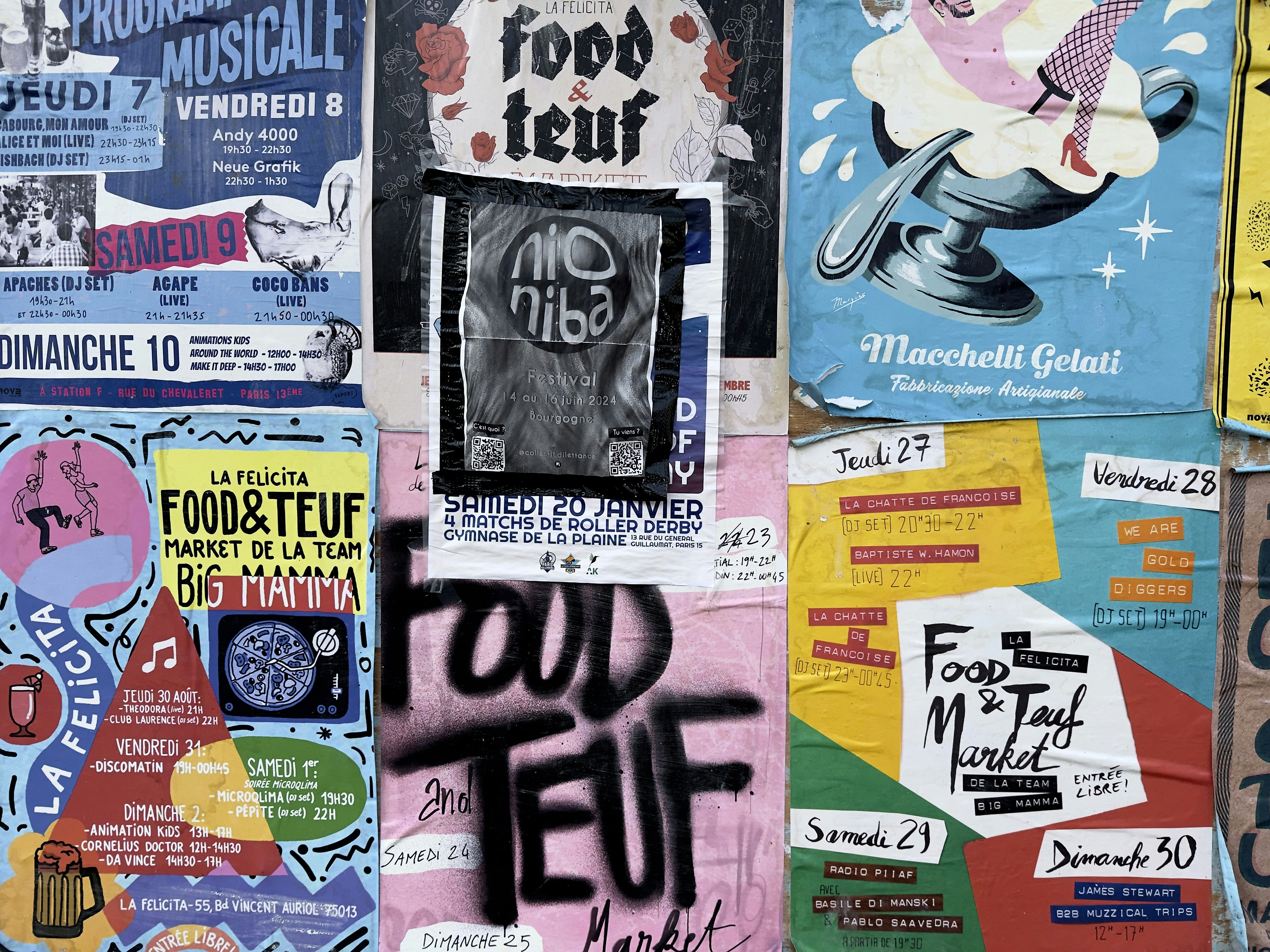 Street posters advertise food and events.