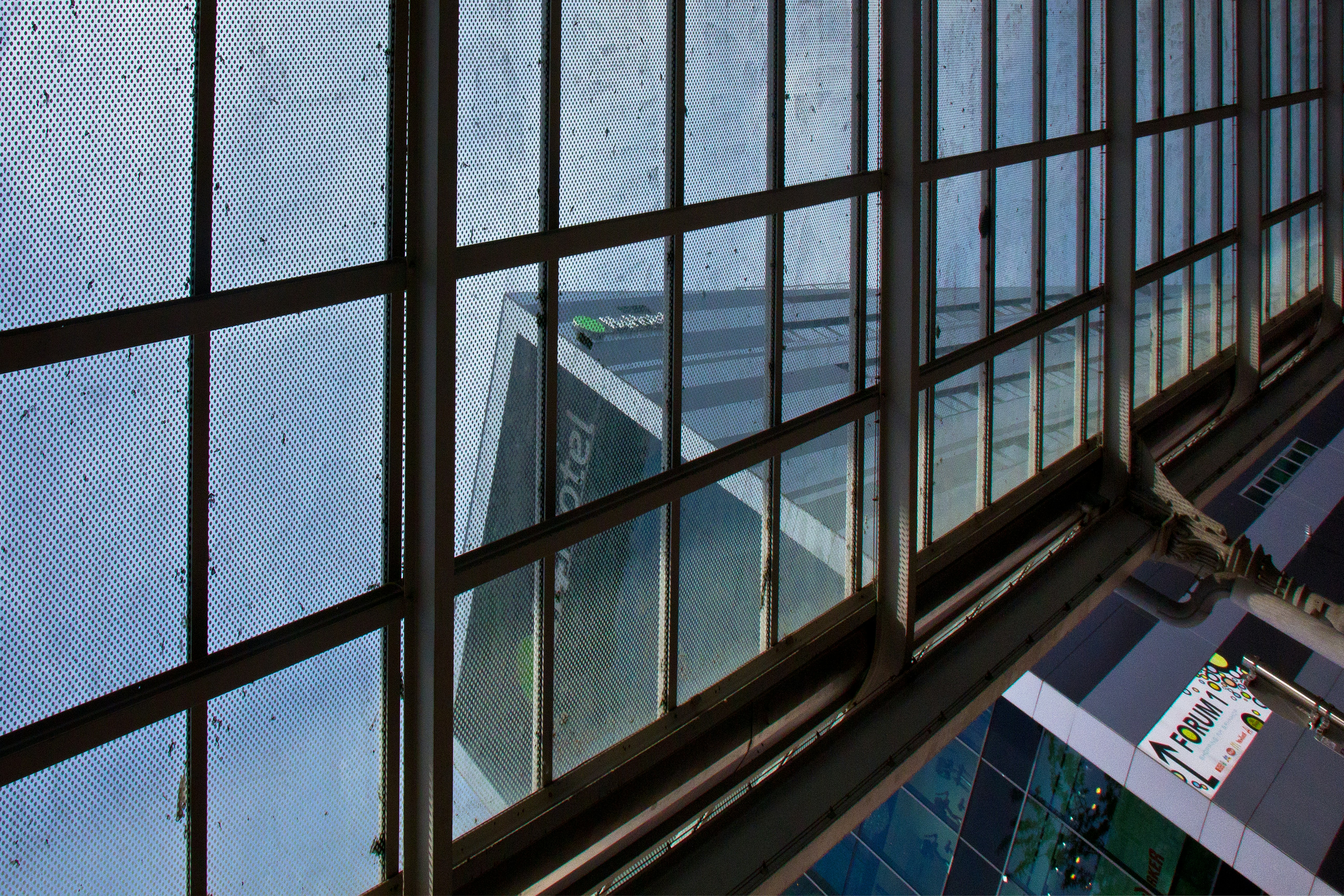 A building reflected through a window.