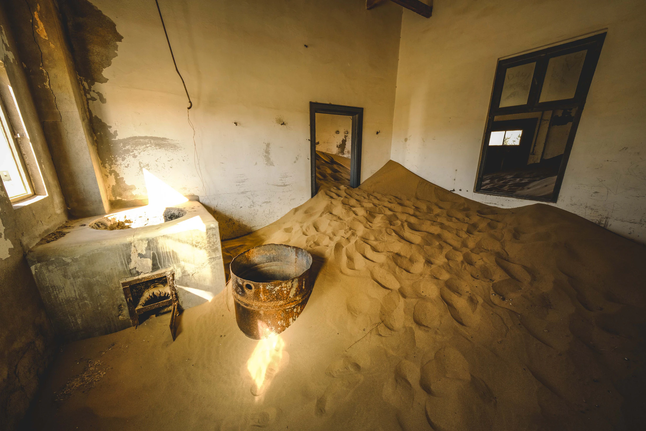 Sand filling an abandoned building in Kolmanskop, Namibia