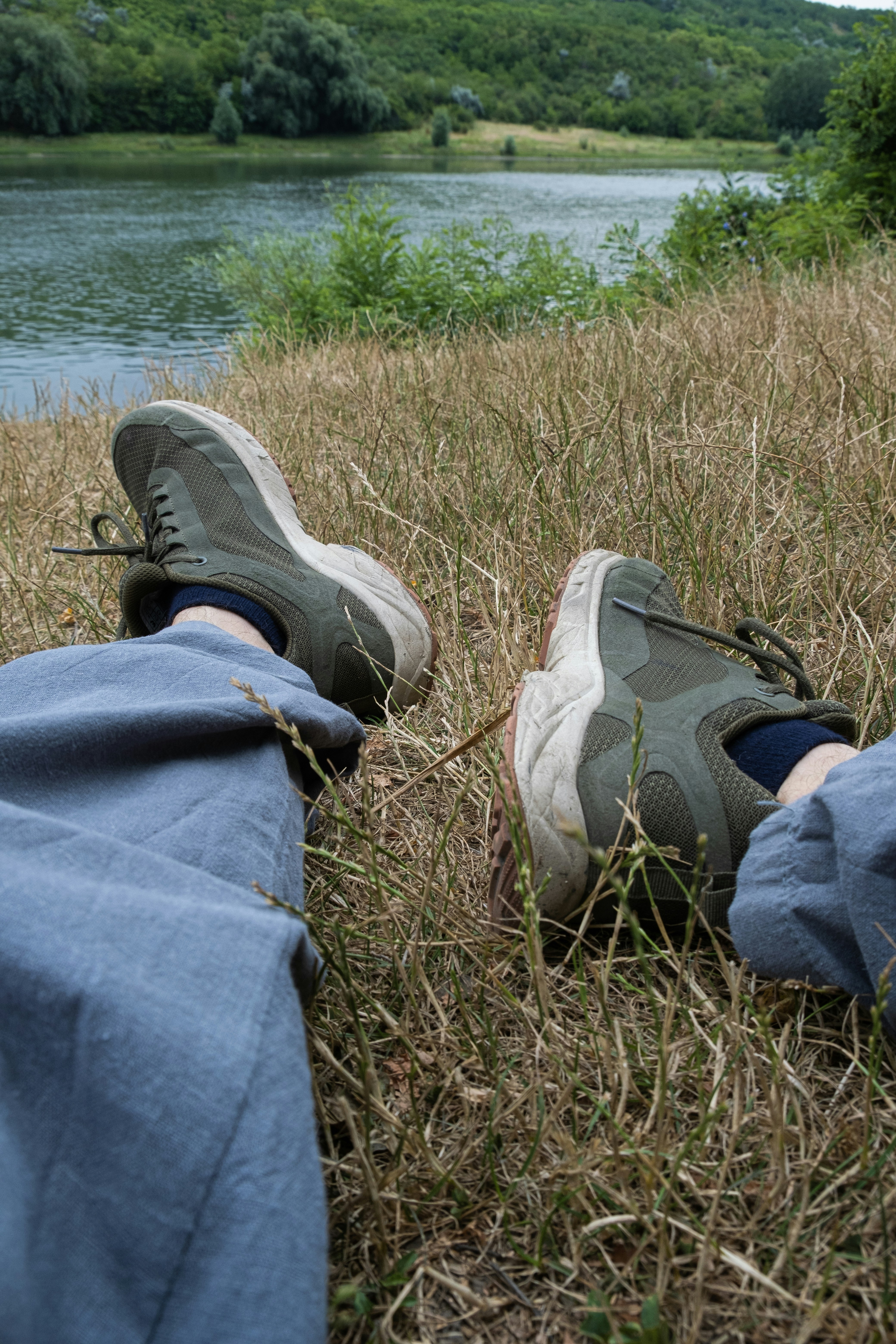 Relaxing by the river with some comfortable shoes.