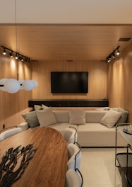 A modern living room with a sleek, wooden design.