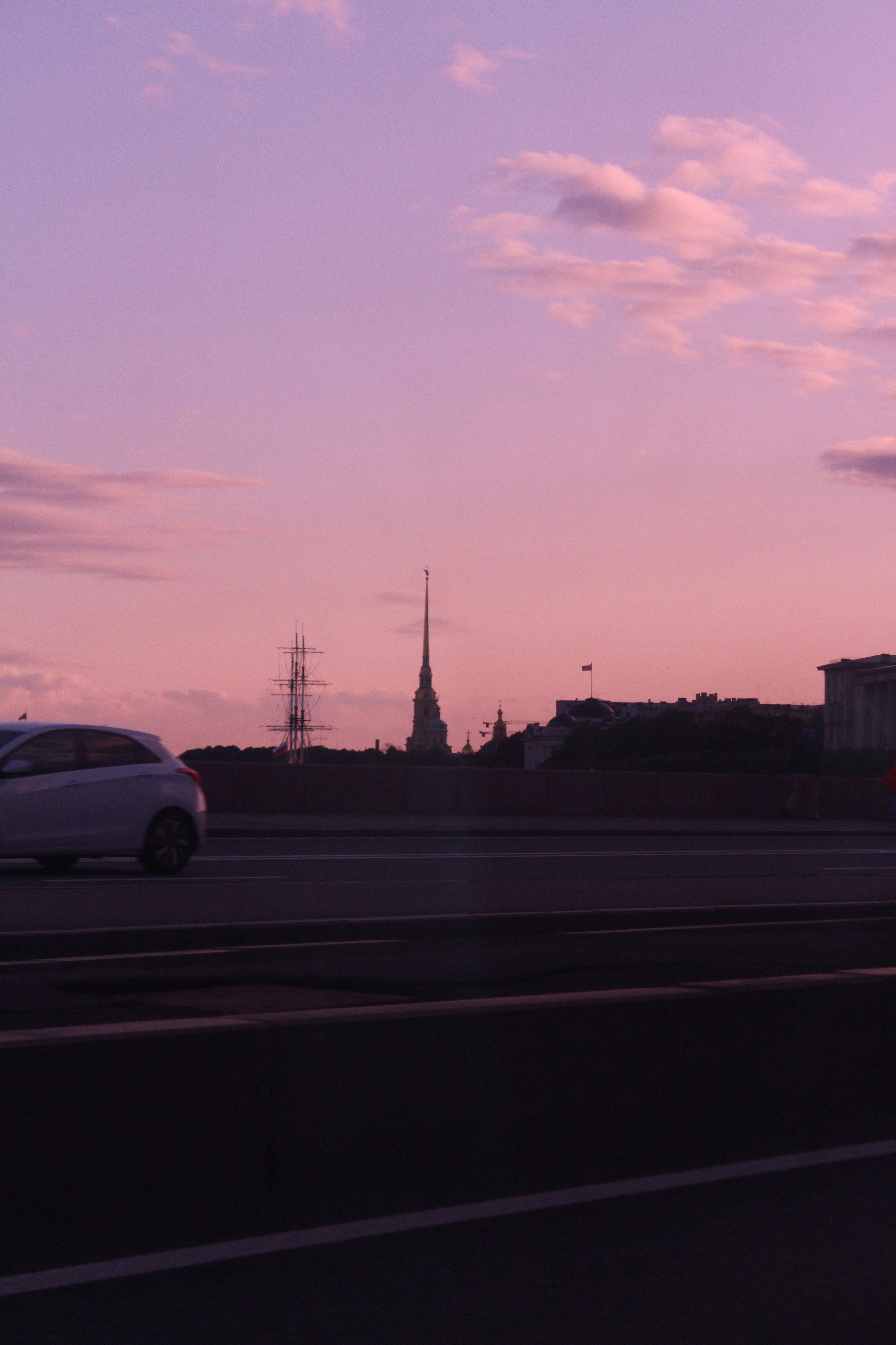 Pink sunset over a city skyline.