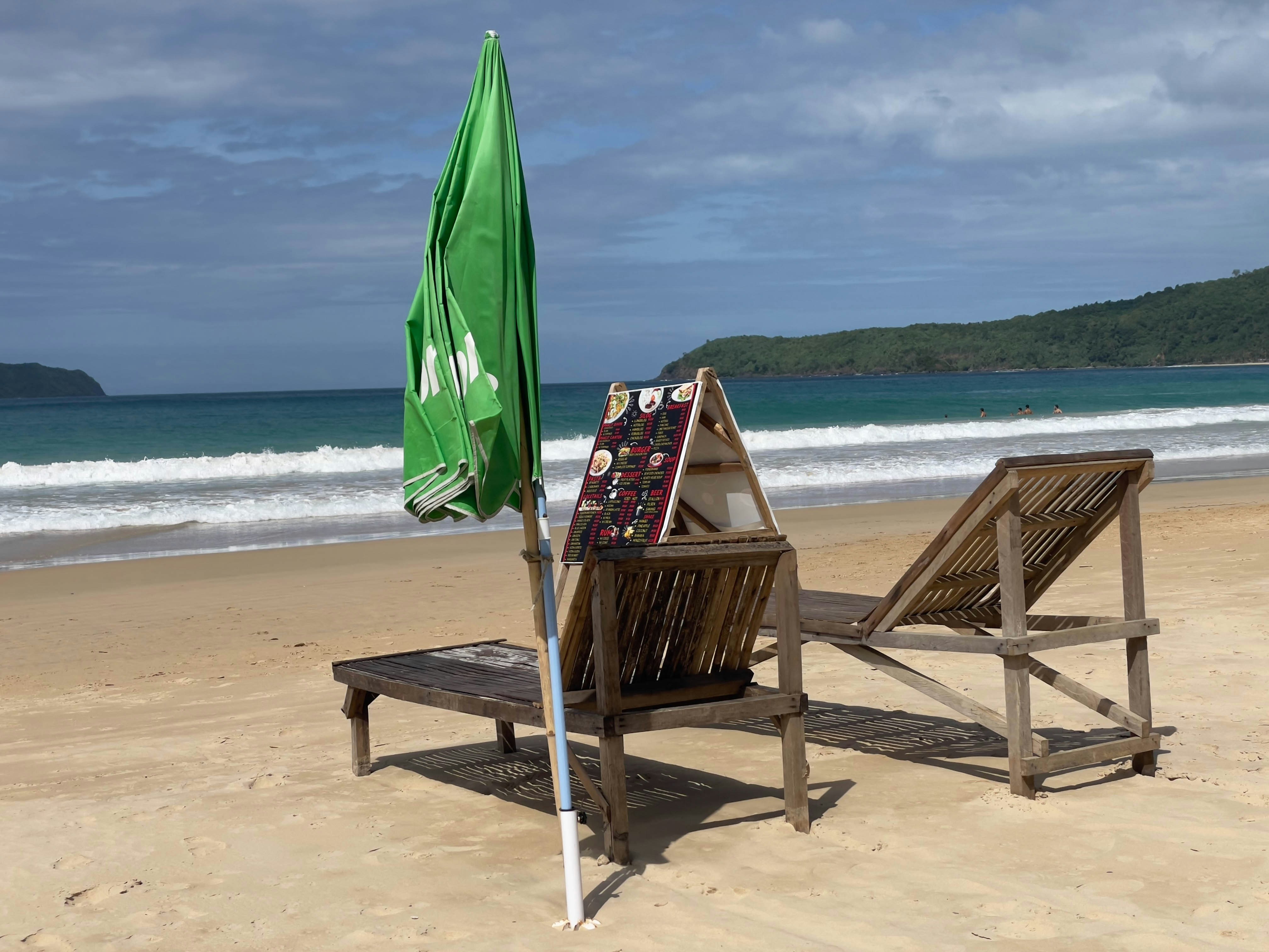Beach chairs and umbrella ready for a sunny day.