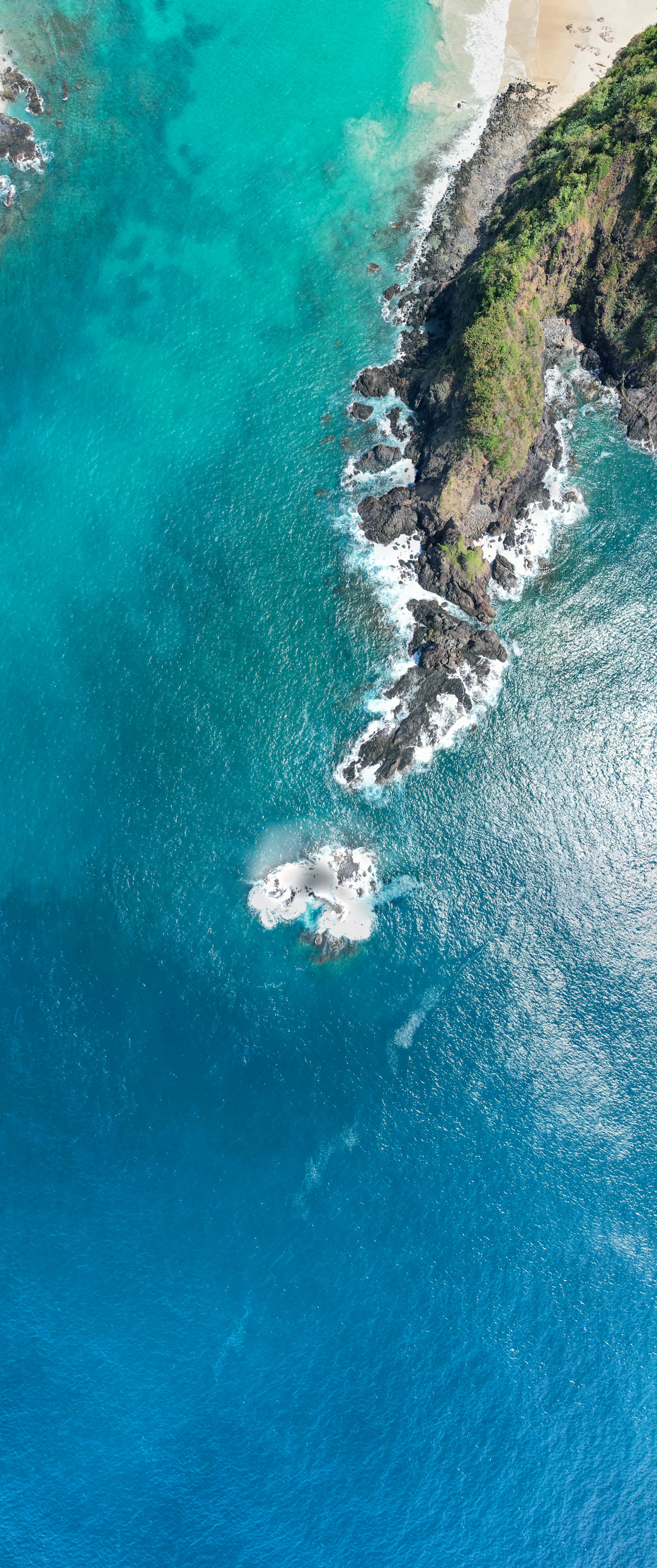 Aerial view of a tropical coastline with turquoise water