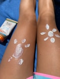 Sunscreen art protects legs from the sun.