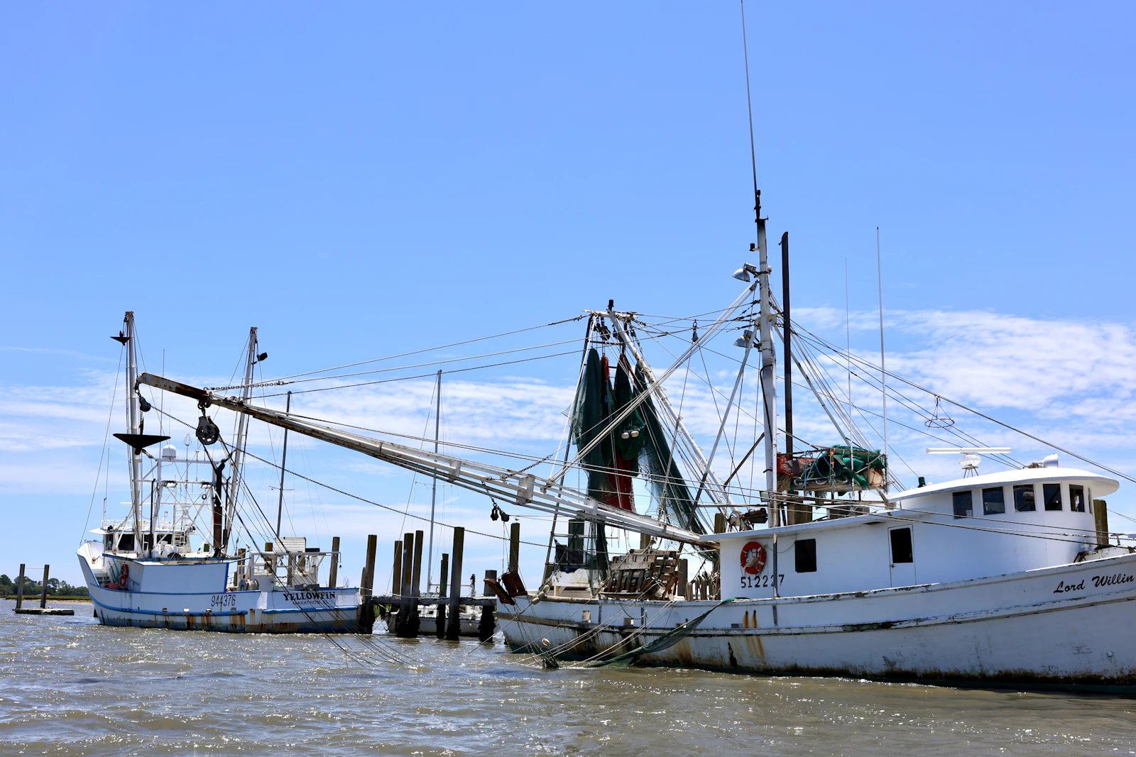 Working boats tied up at a dock.