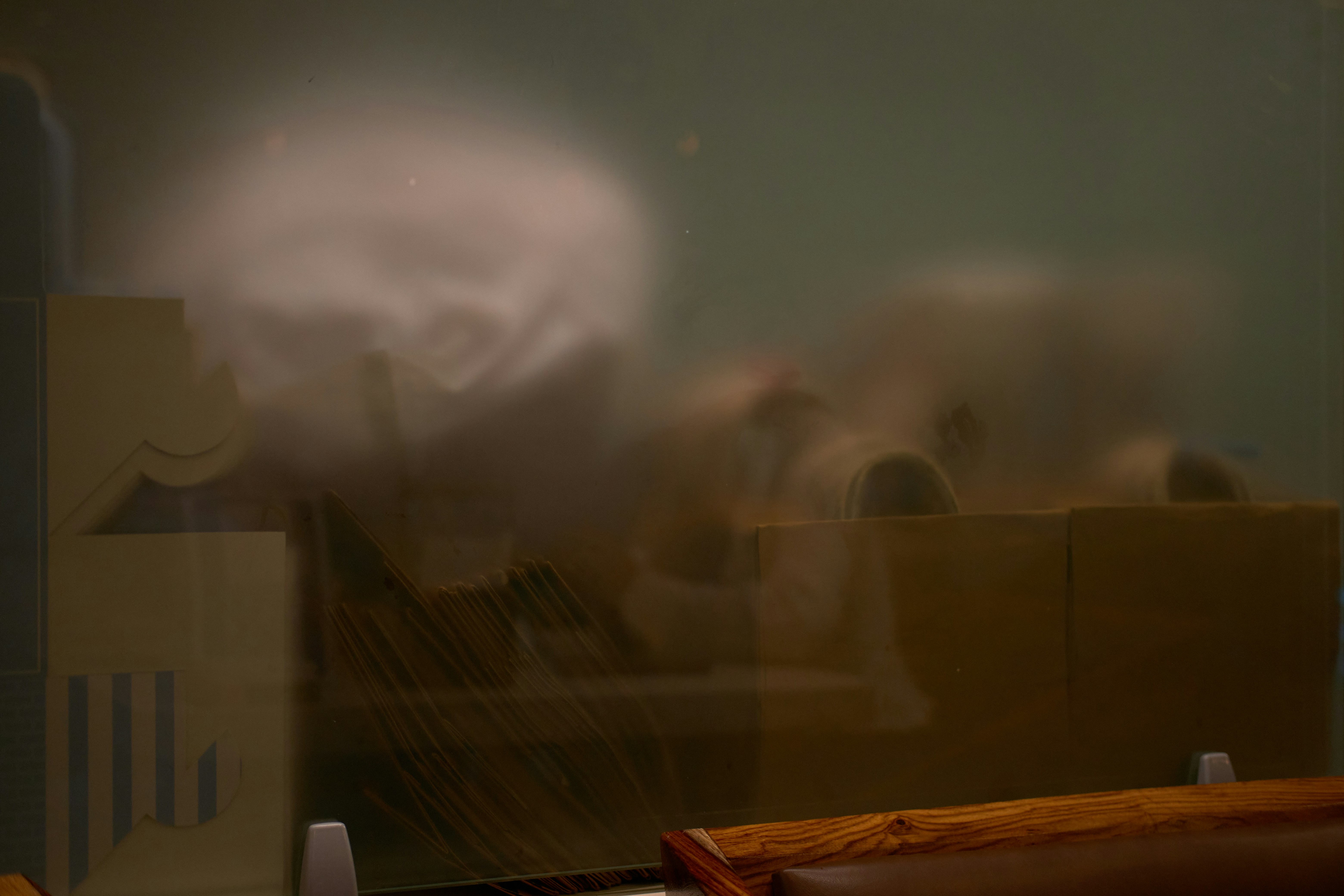The blurred image shows objects and shapes.