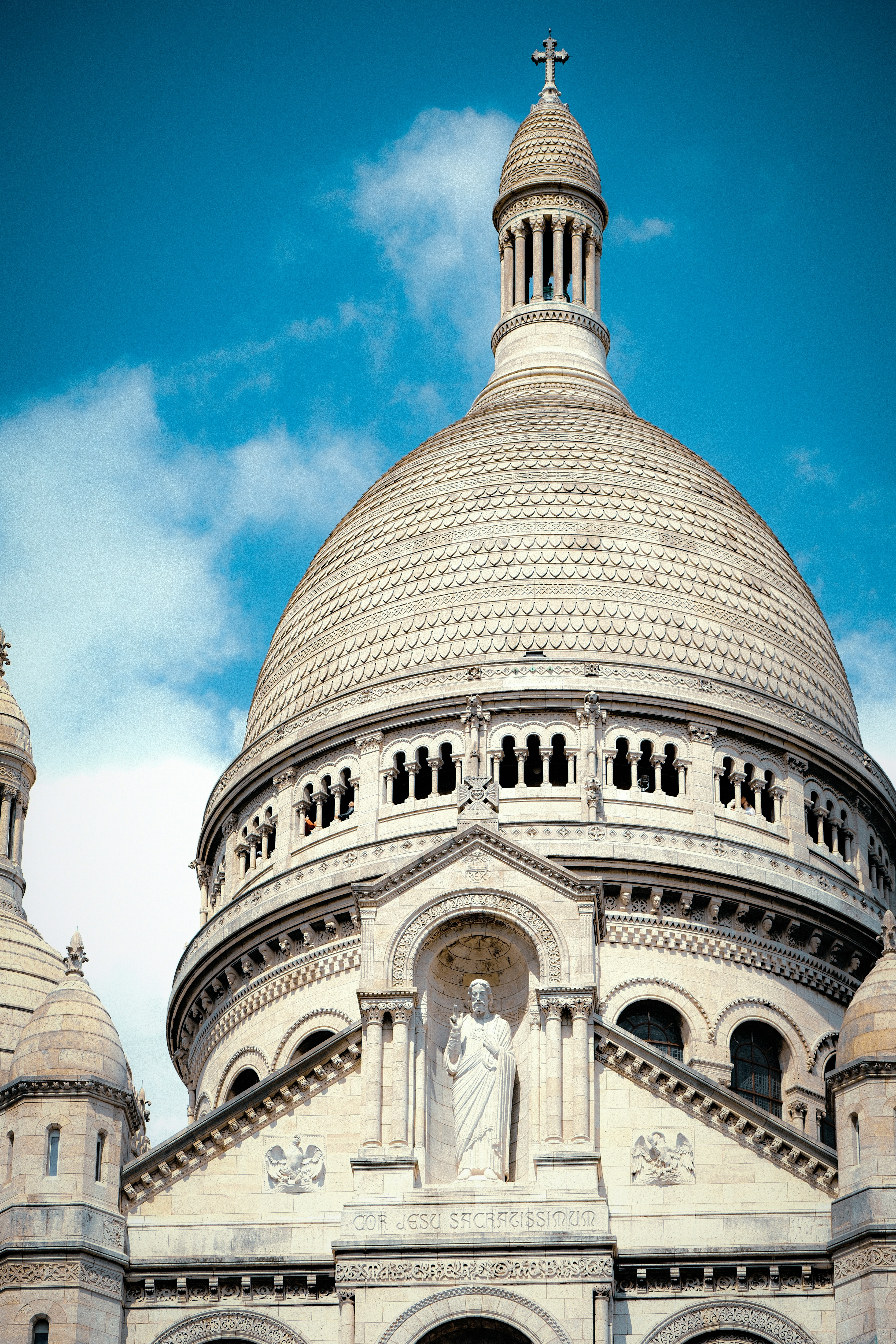 A stunning cathedral rises against a blue sky.