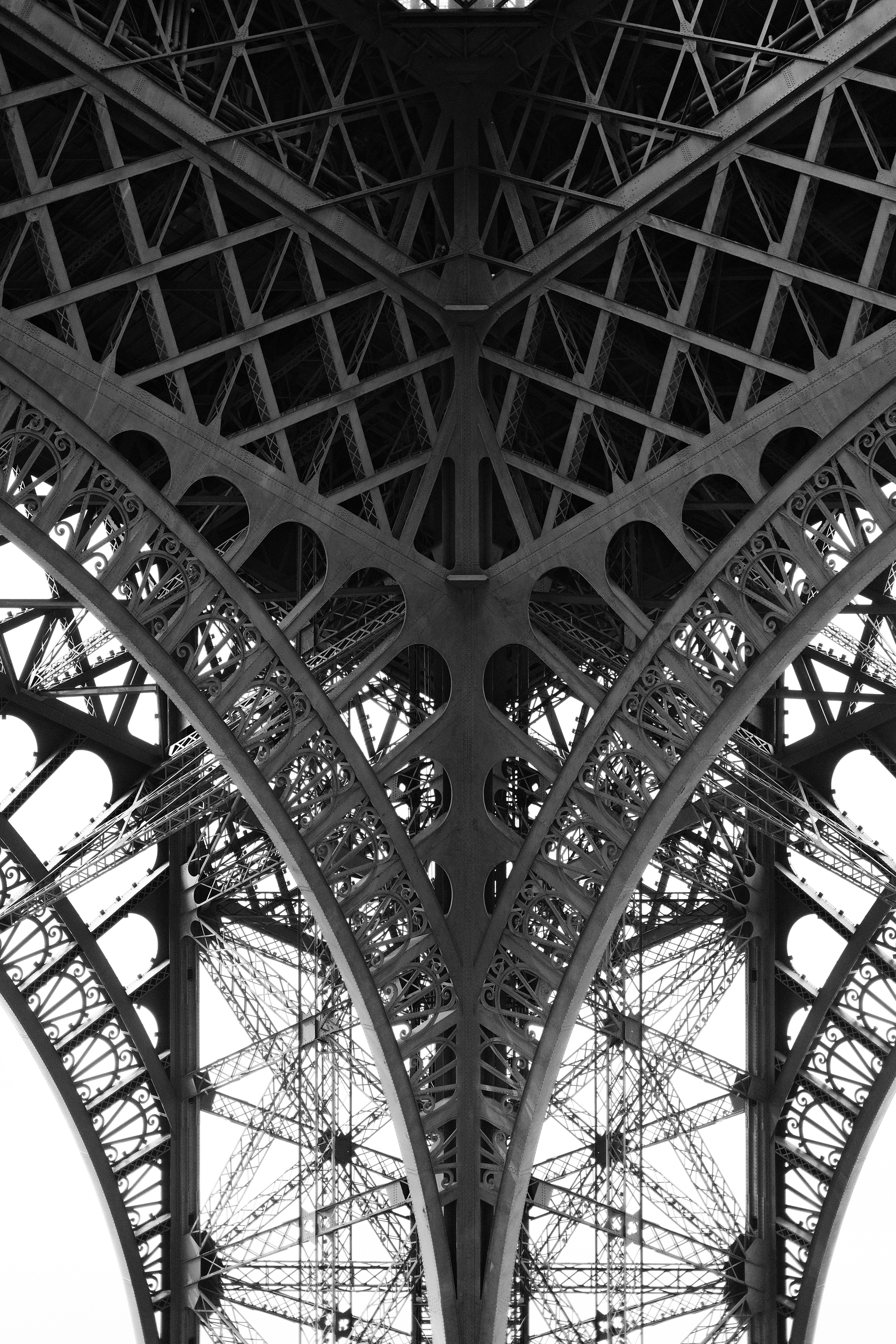 The eiffel tower's intricate steel framework is depicted.
