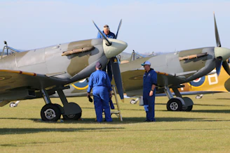 Mechanics prepare classic planes for flight.