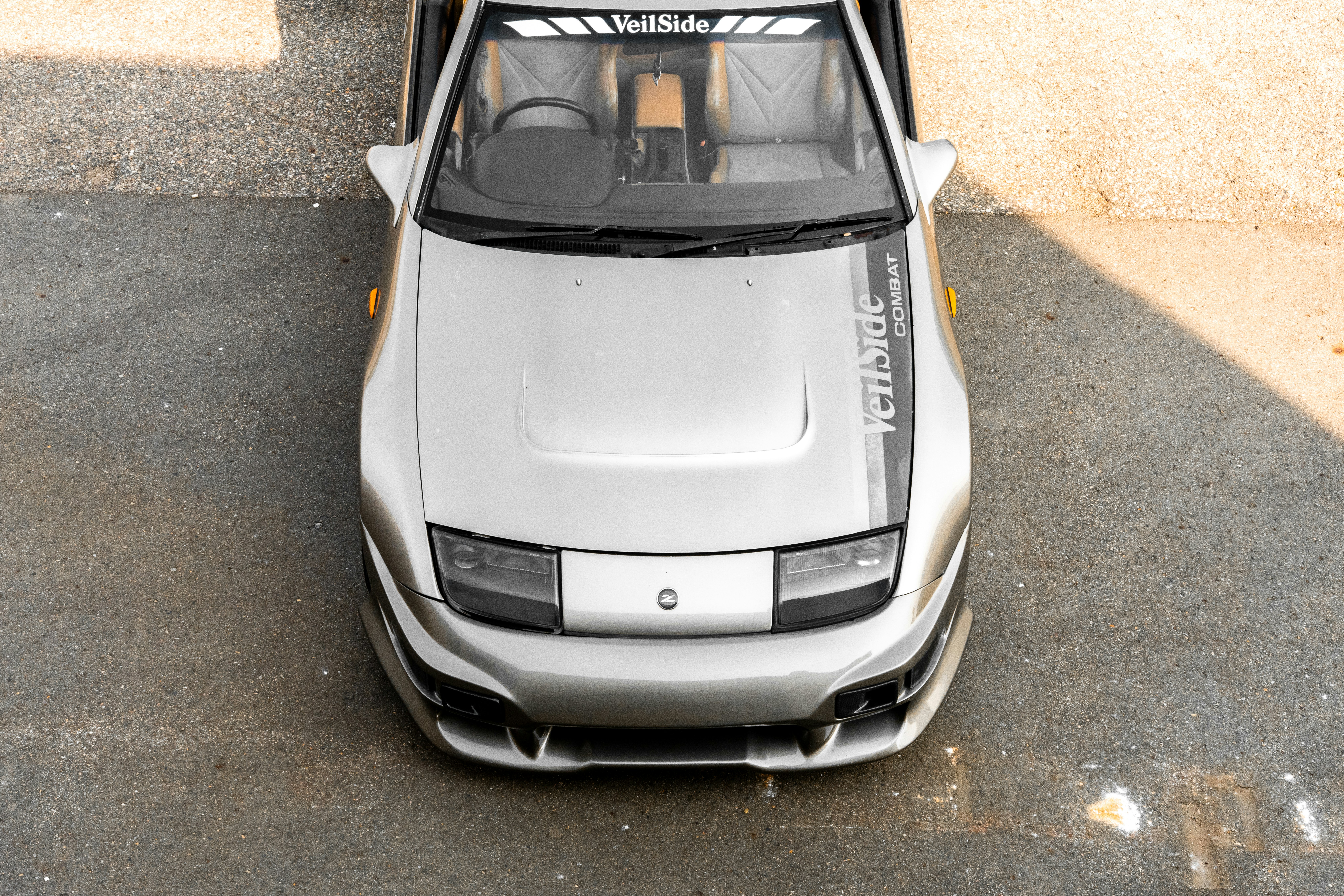 A silver car is shown from above.