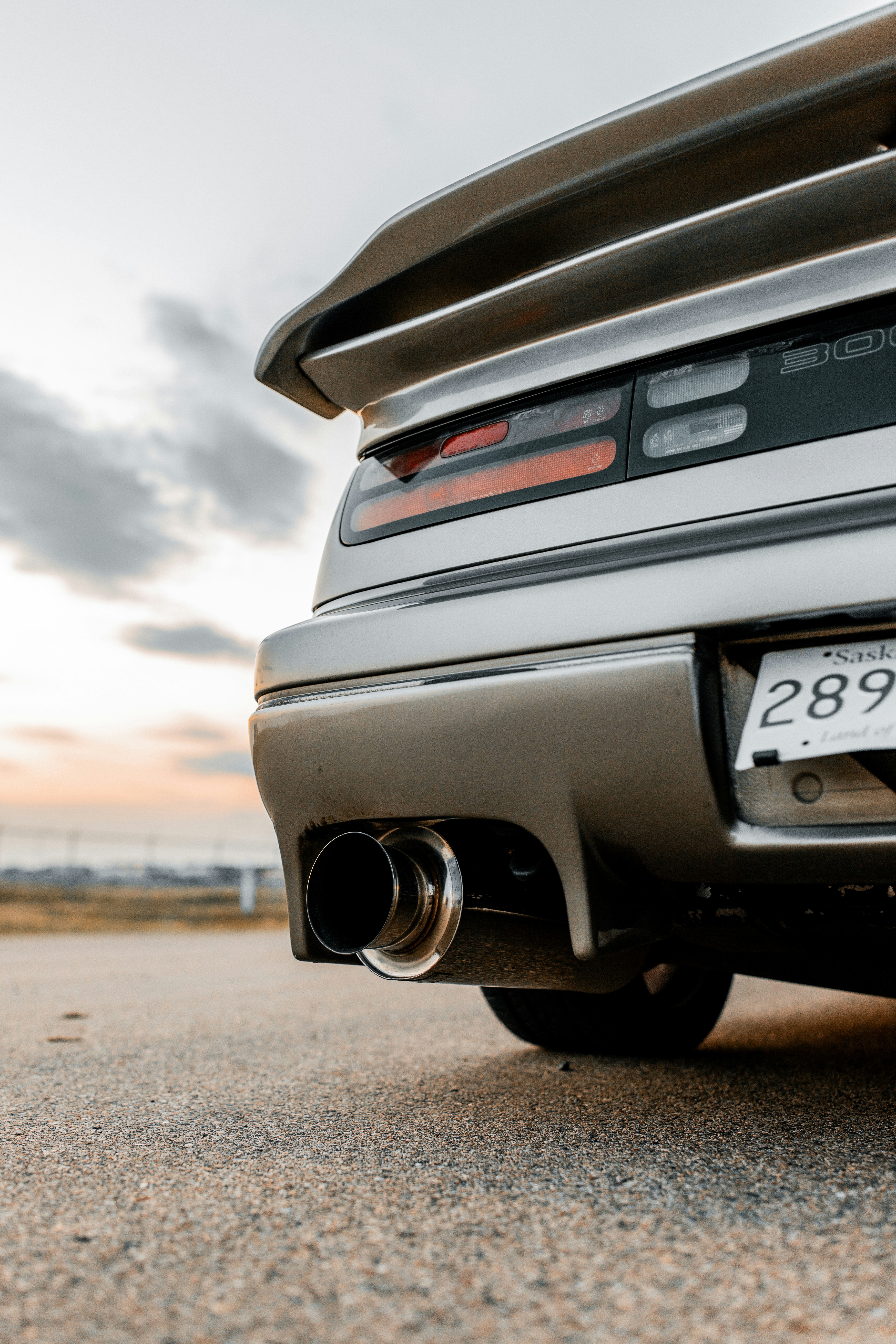 Rear view of a sleek silver sports car.