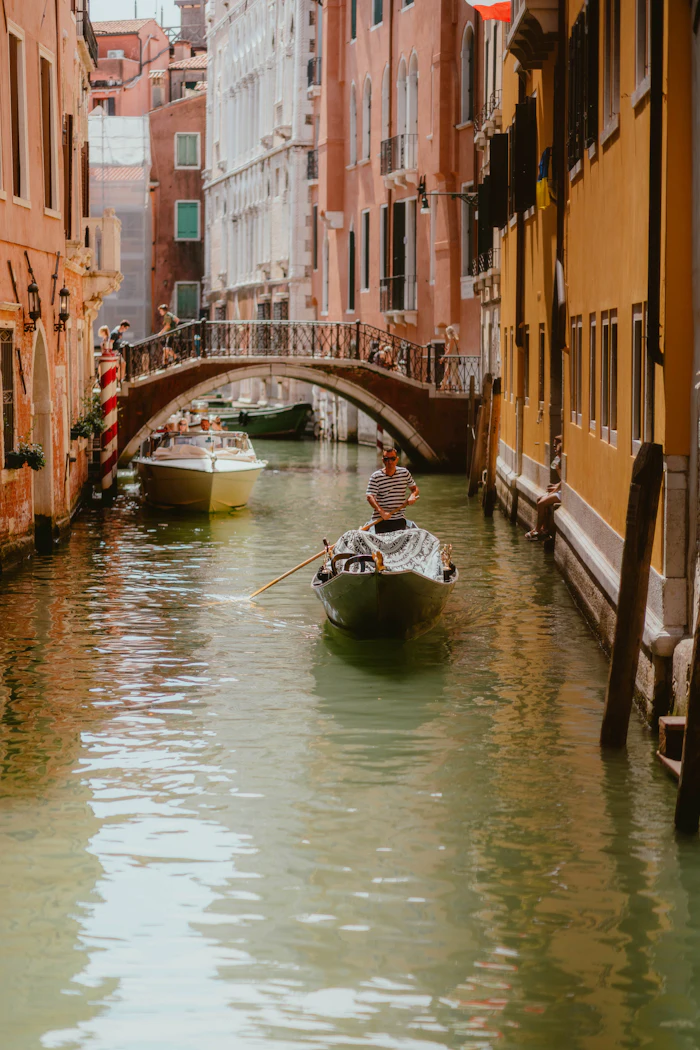 A gondola gliding through a quiet Venice canal
