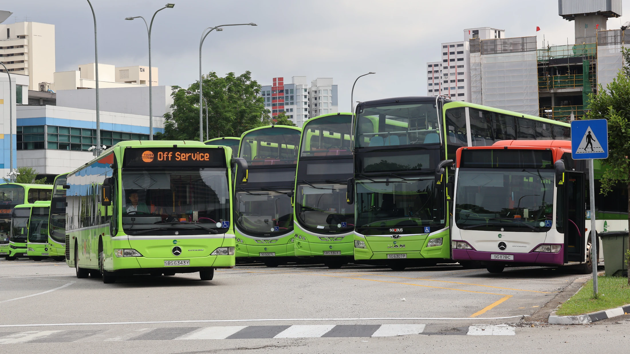 Commercial buses parked in a fleet depot