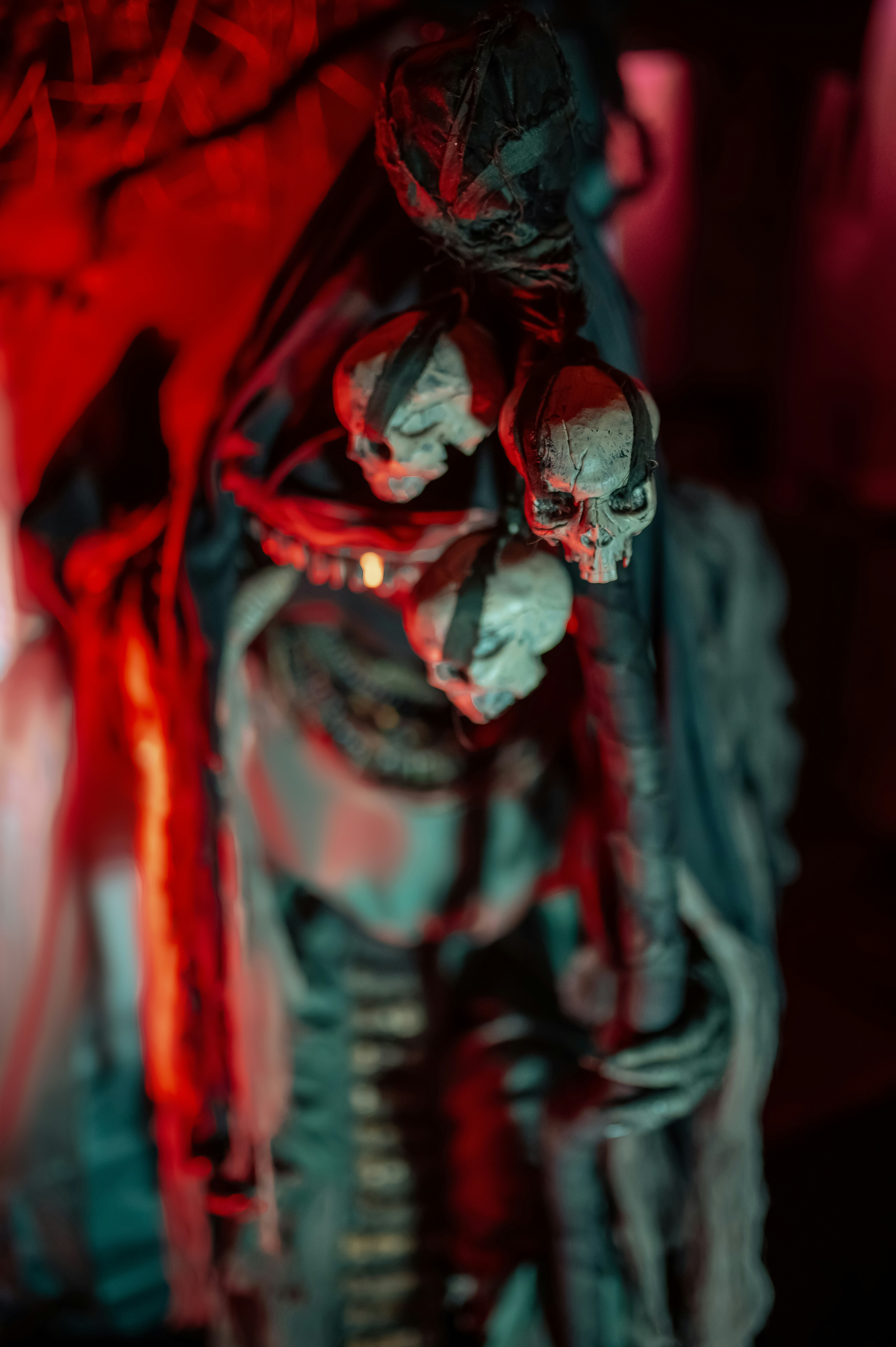 A creepy skeleton with three skulls is pictured.