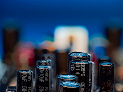 Close-up of electronic capacitors on a circuit board.