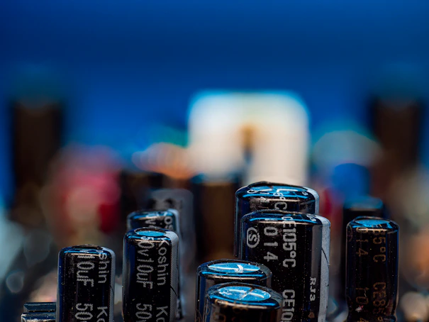Close-up of electronic capacitors on a circuit board.