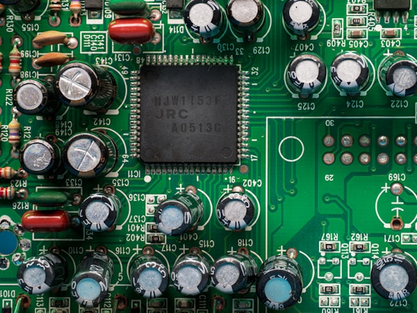 Close-up of precision markings on a circuit board surface, showing laser direct marking detail