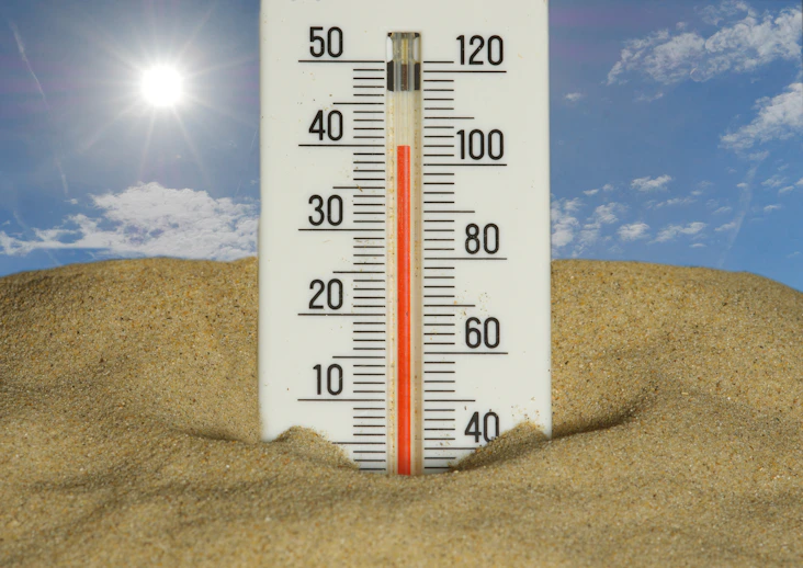 The thermometer shows a very hot temperature.