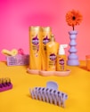 Seda hair products arranged on a colorful table.
