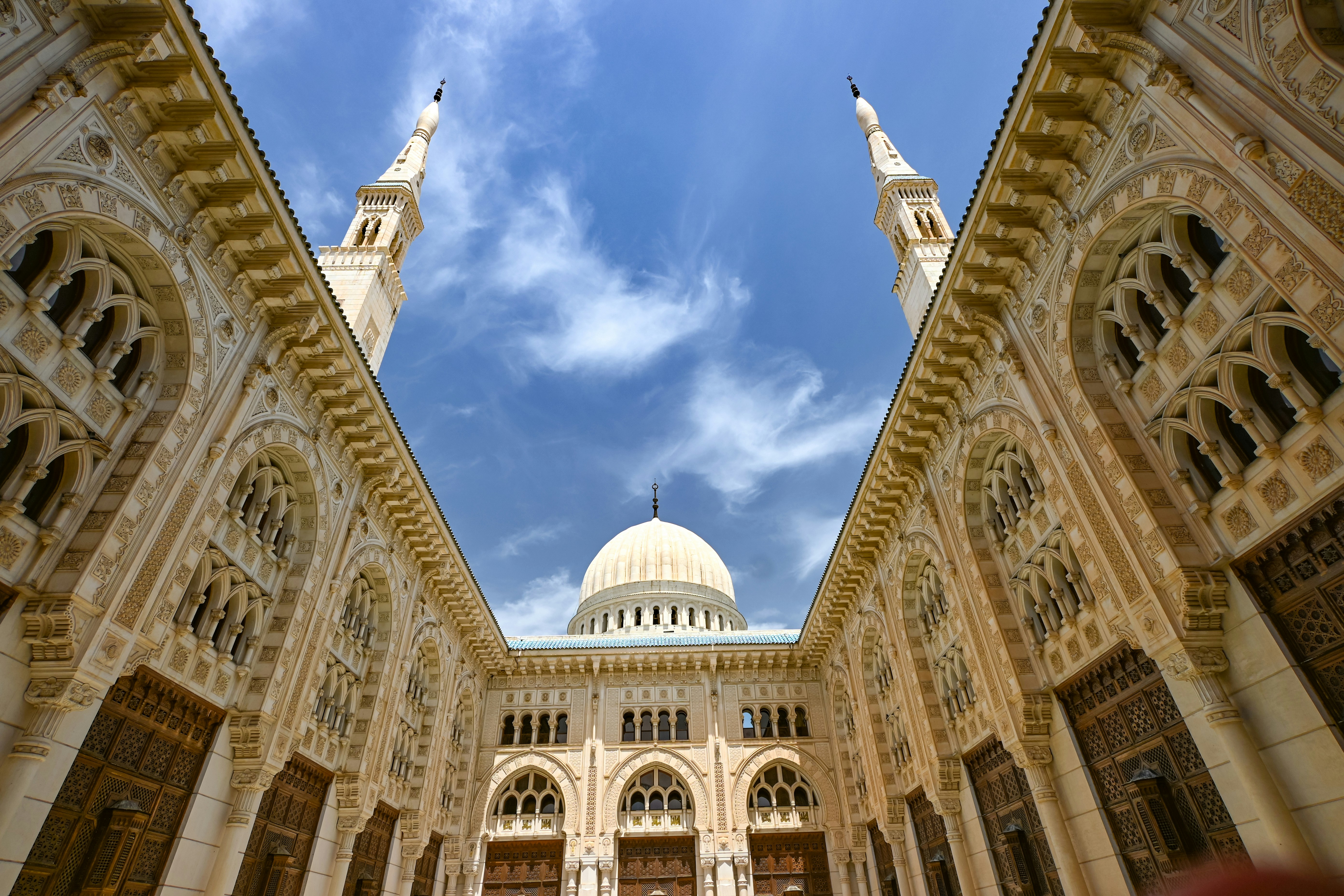 Mosque architecture against a blue sky.