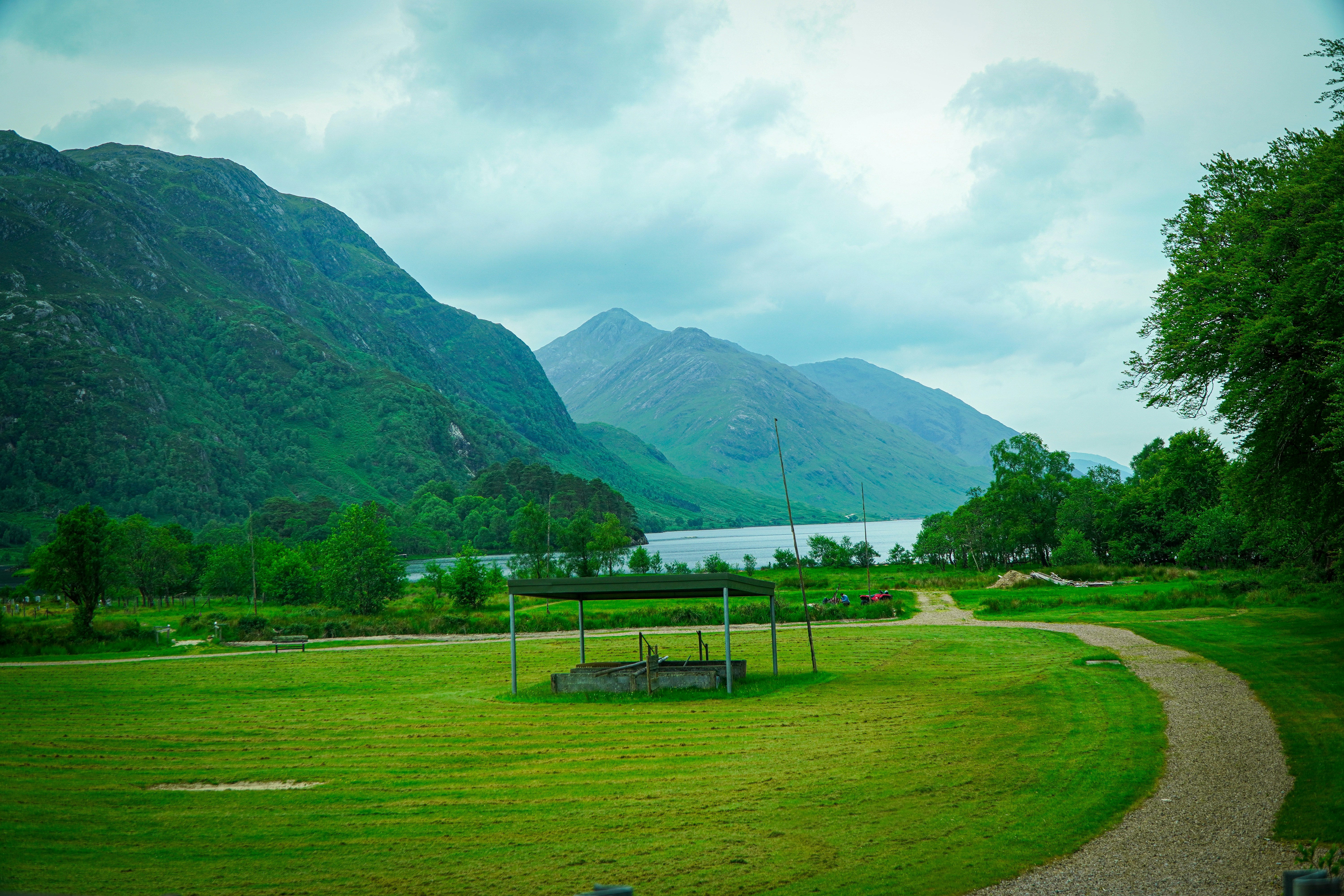 Mountains and a lake are shown in this landscape.