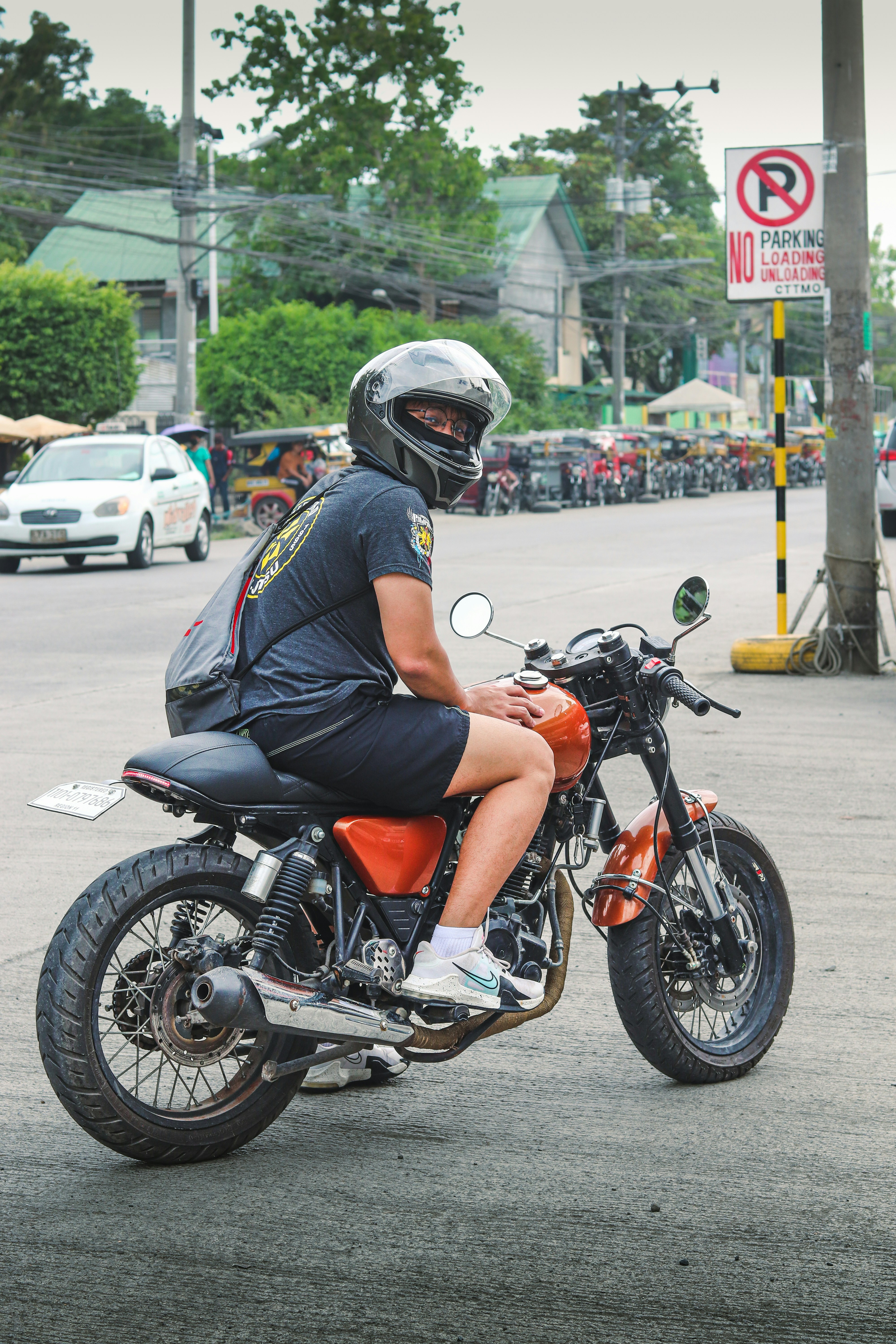 A rider is sitting on a motorcycle.