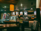 A coffee shop interior, warm light