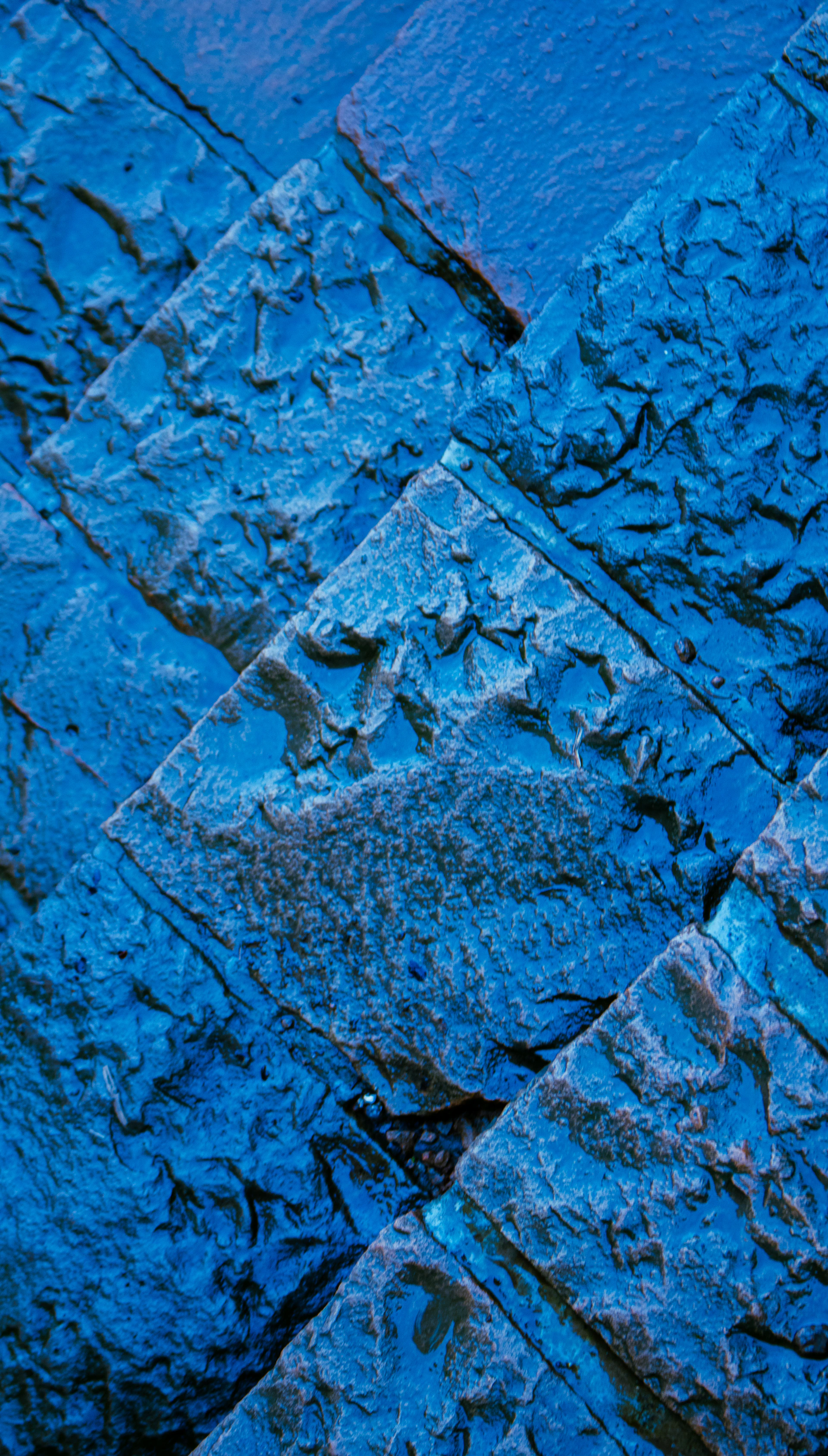 Blue stone tiles are arranged in a diagonal pattern.