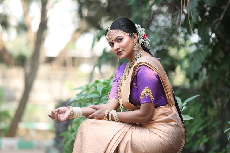 Woman poses beautifully in traditional attire.