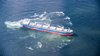 A cargo ship is sailing in the open ocean.