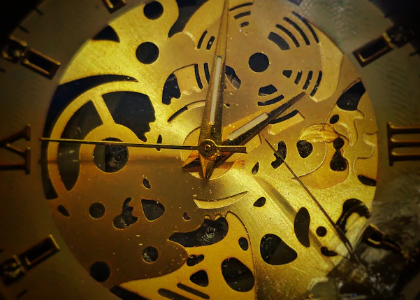 Close-up view of a golden clock mechanism.
