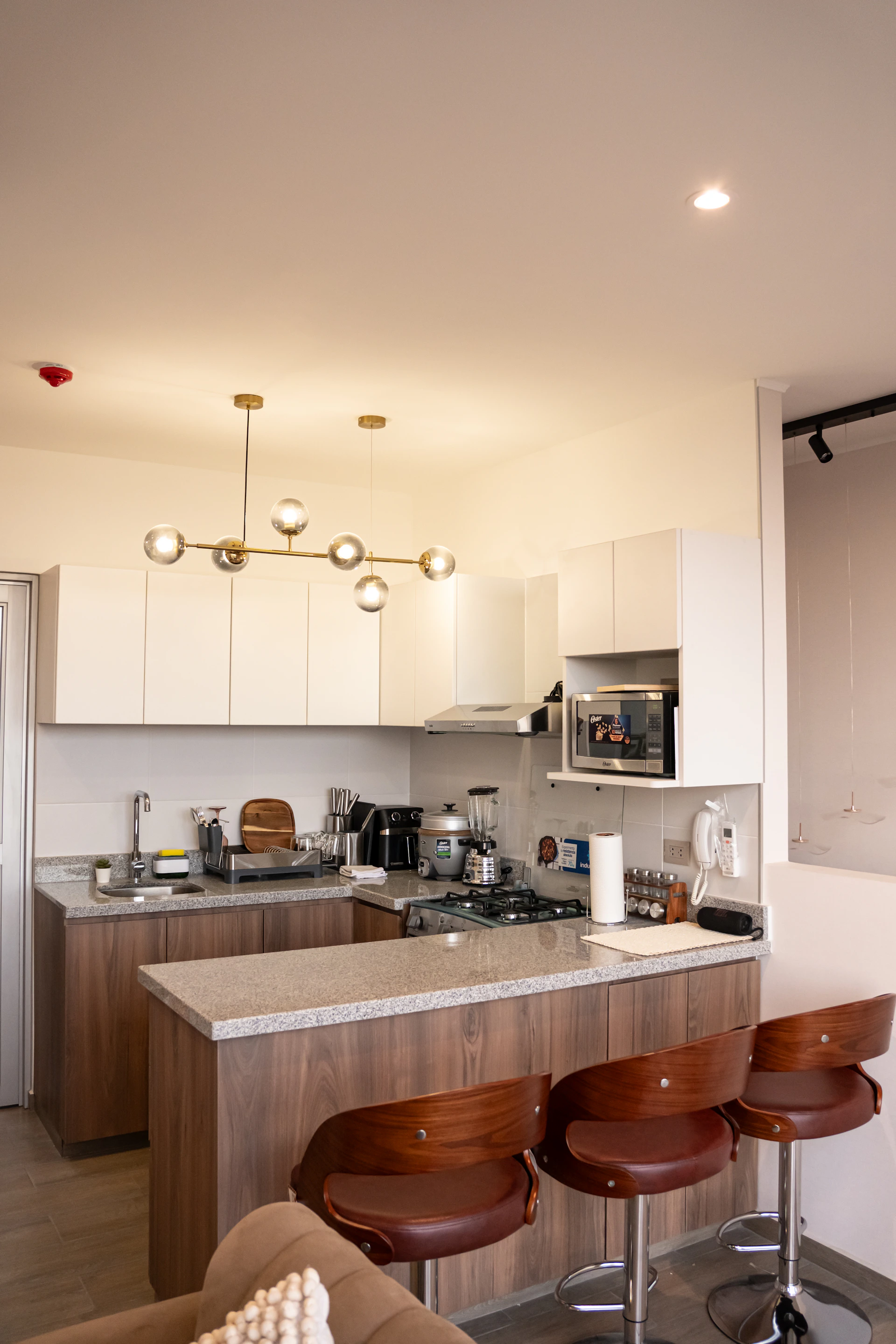 A modern kitchen with bar stools