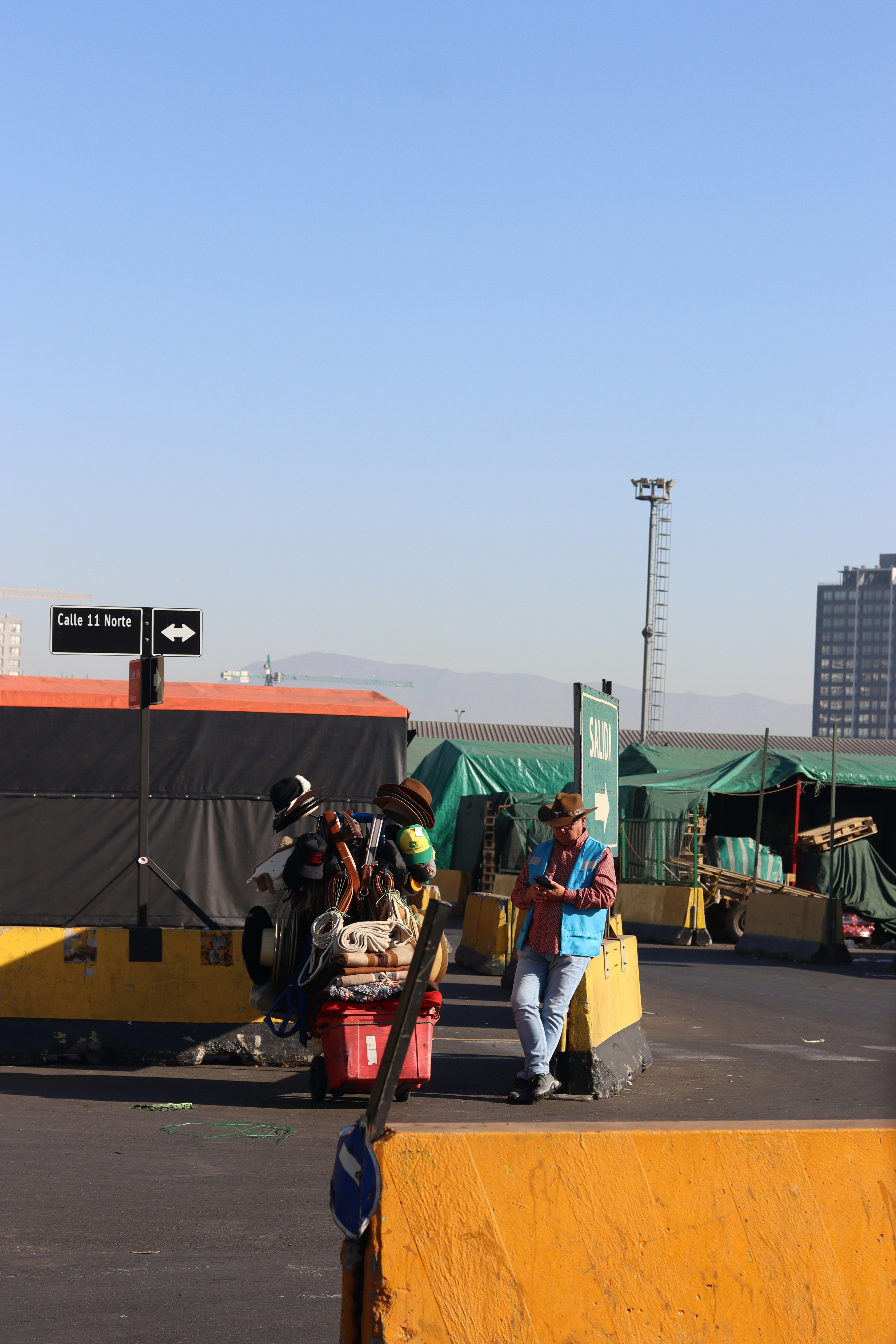 A man rests near his loaded cart.