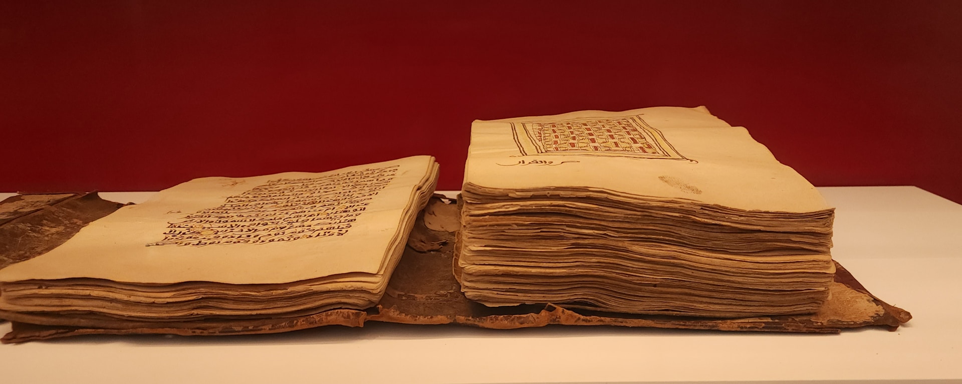 Here's a short caption: an old book is open, displaying pages.