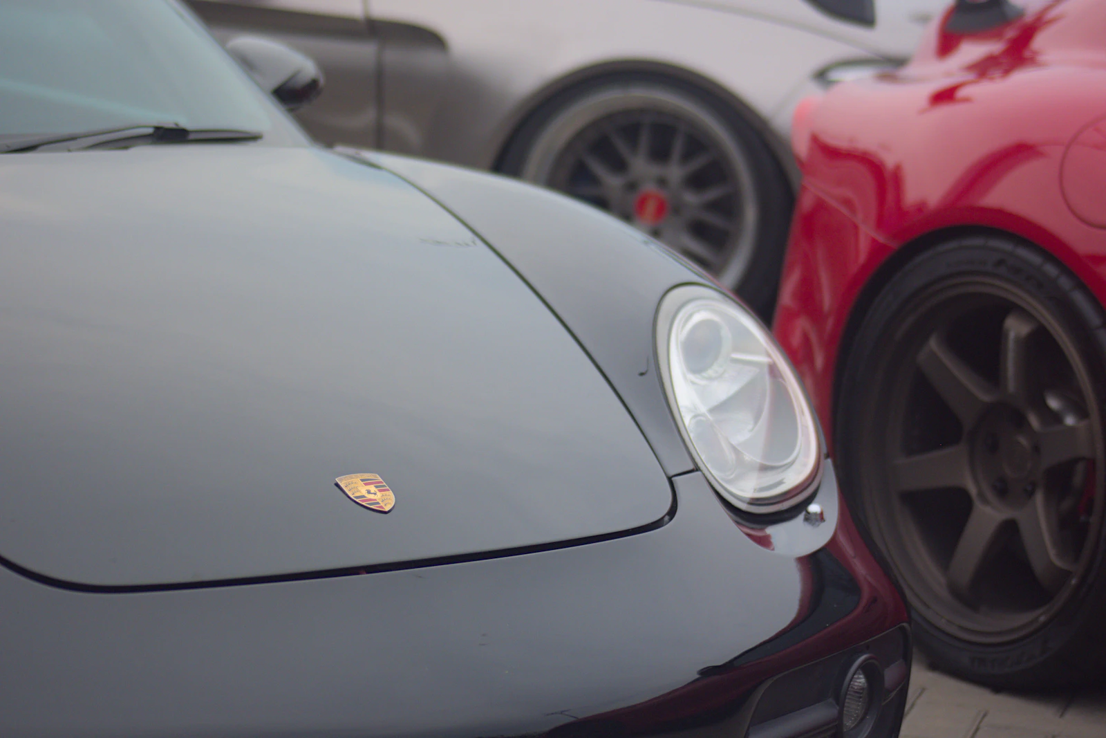 Black Porsche shining under studio lights