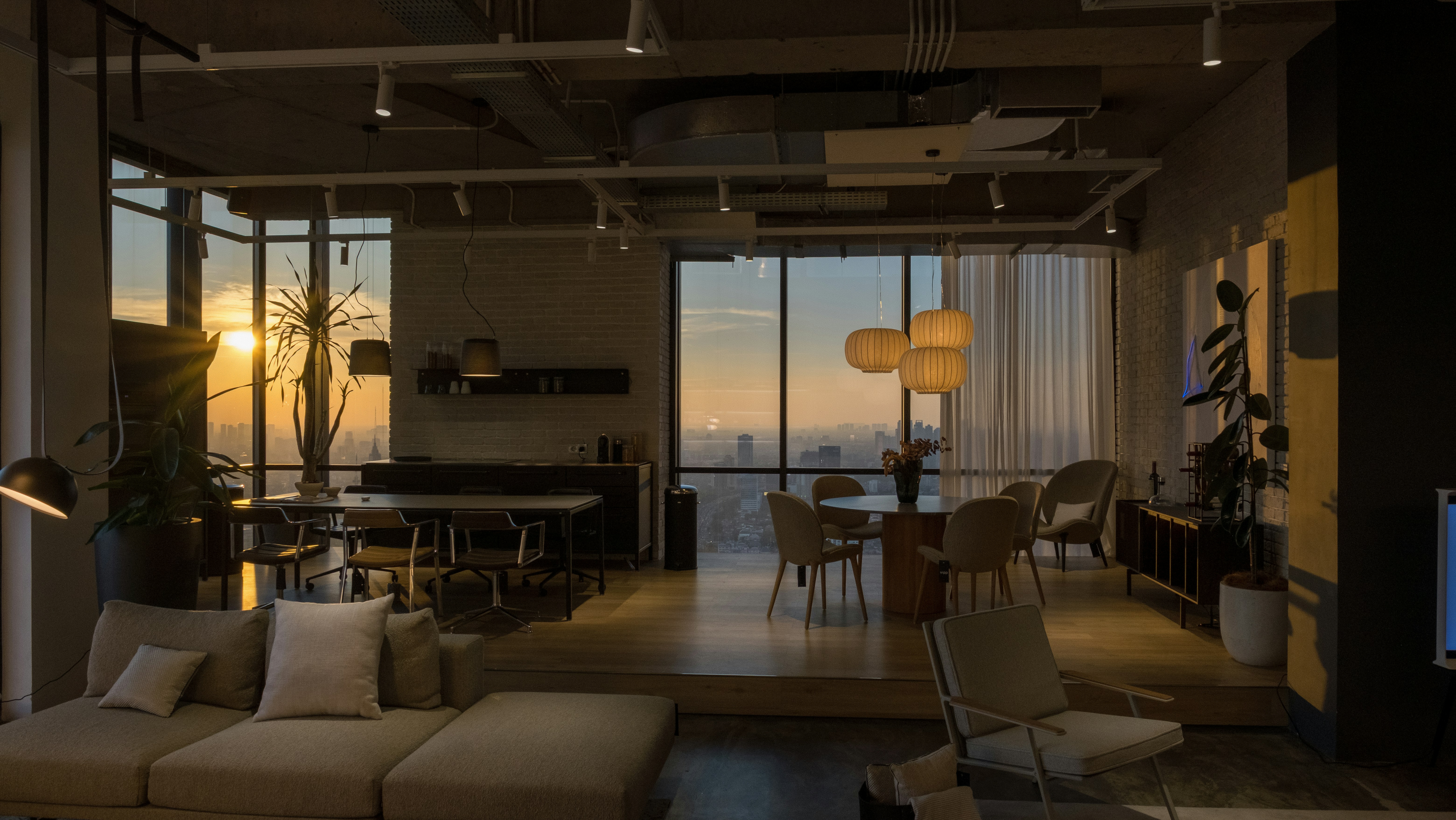 a modern apartment interior with floor-to-ceiling windows showing the city skyline - River North apartment rentals