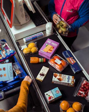 Groceries are being scanned at a supermarket checkout.