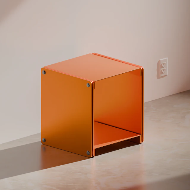 An orange cube-shaped side table on a plain background