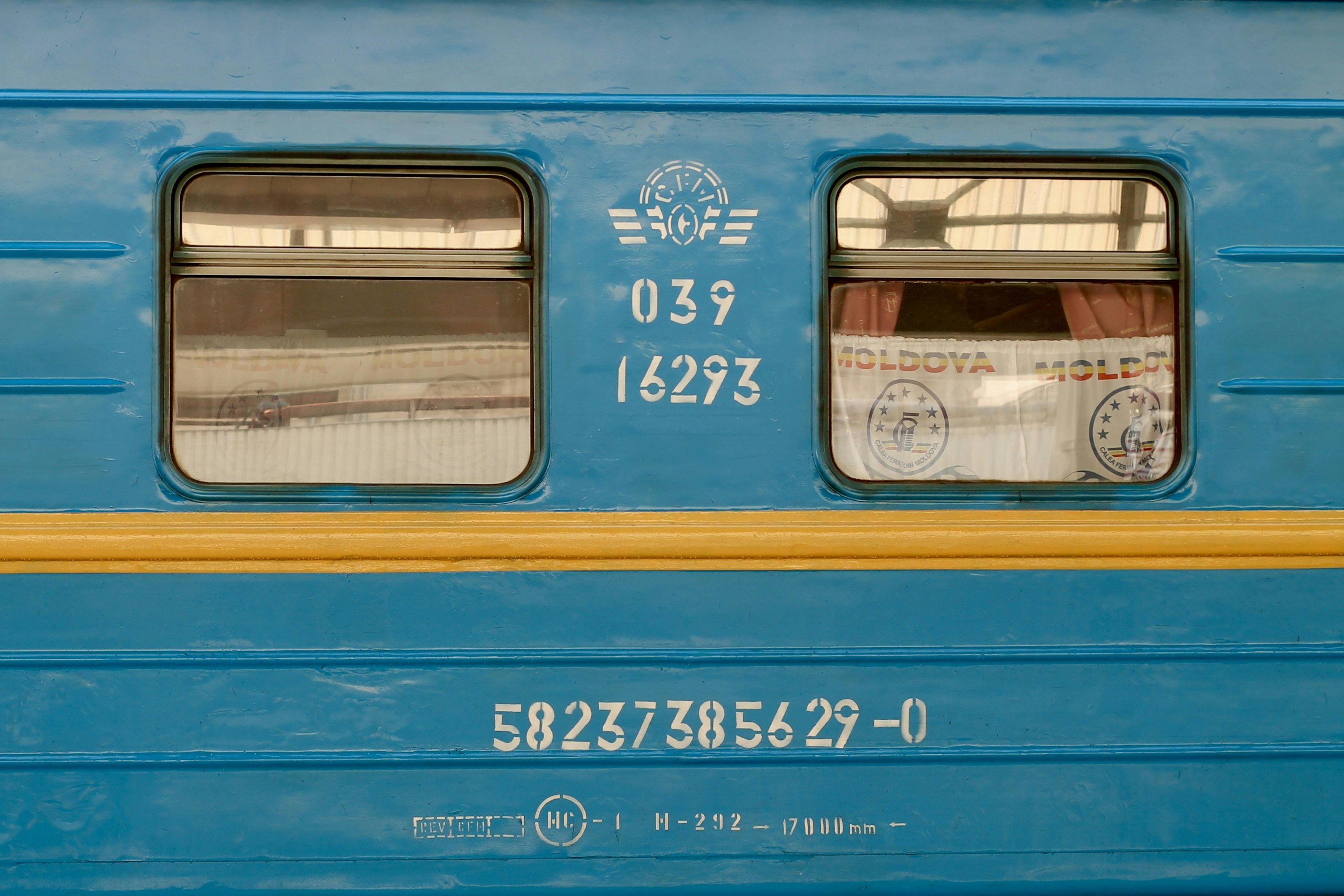 Train car windows with markings.