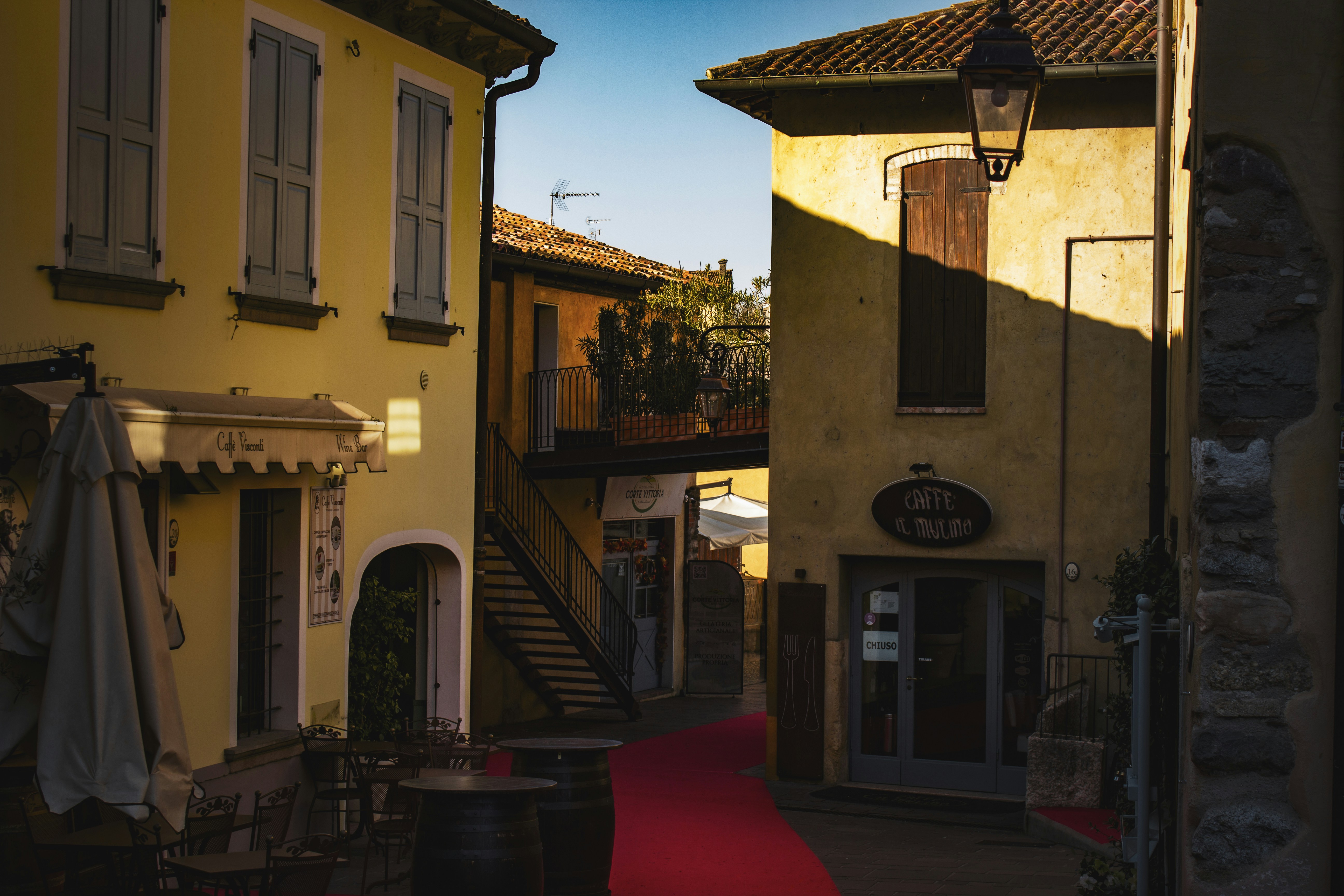 Quaint italian street scene bathed in sunlight.