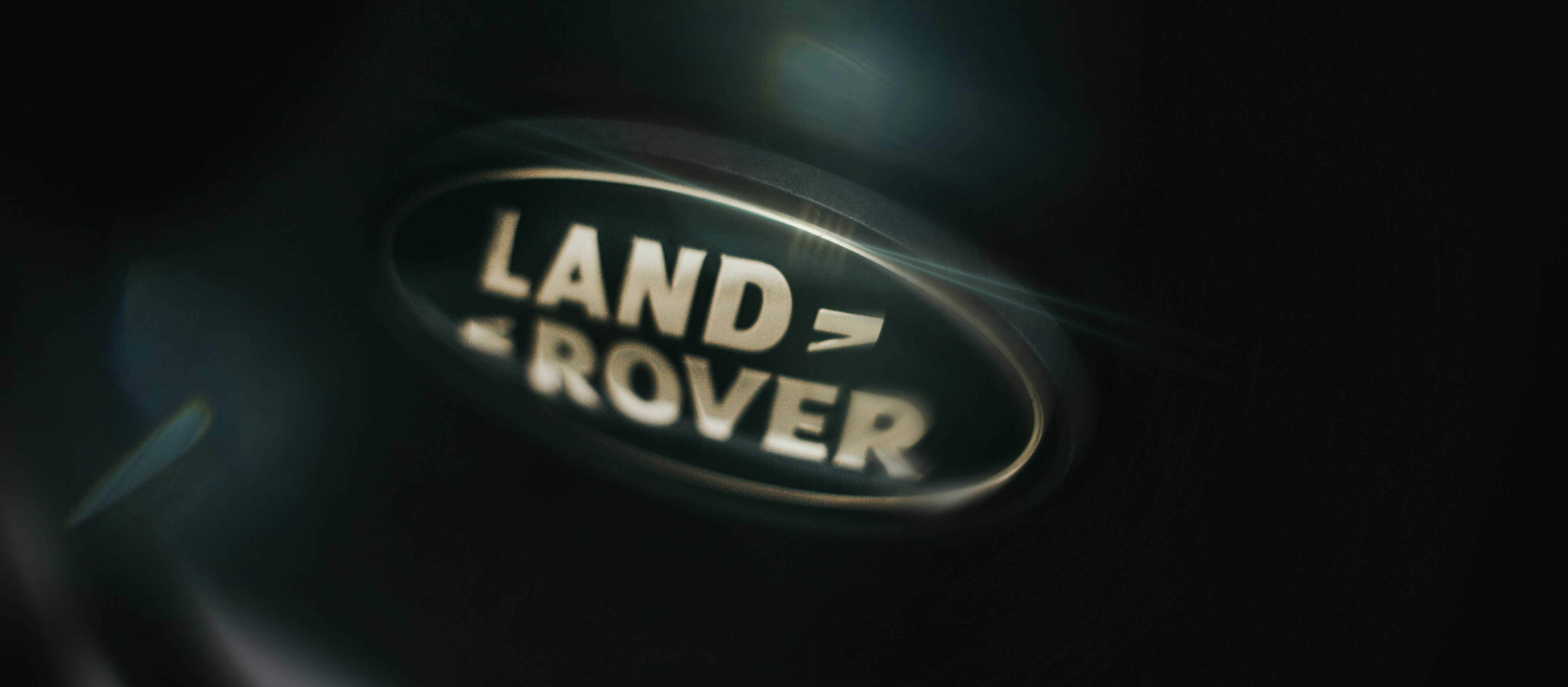 Land rover logo on a dark surface.