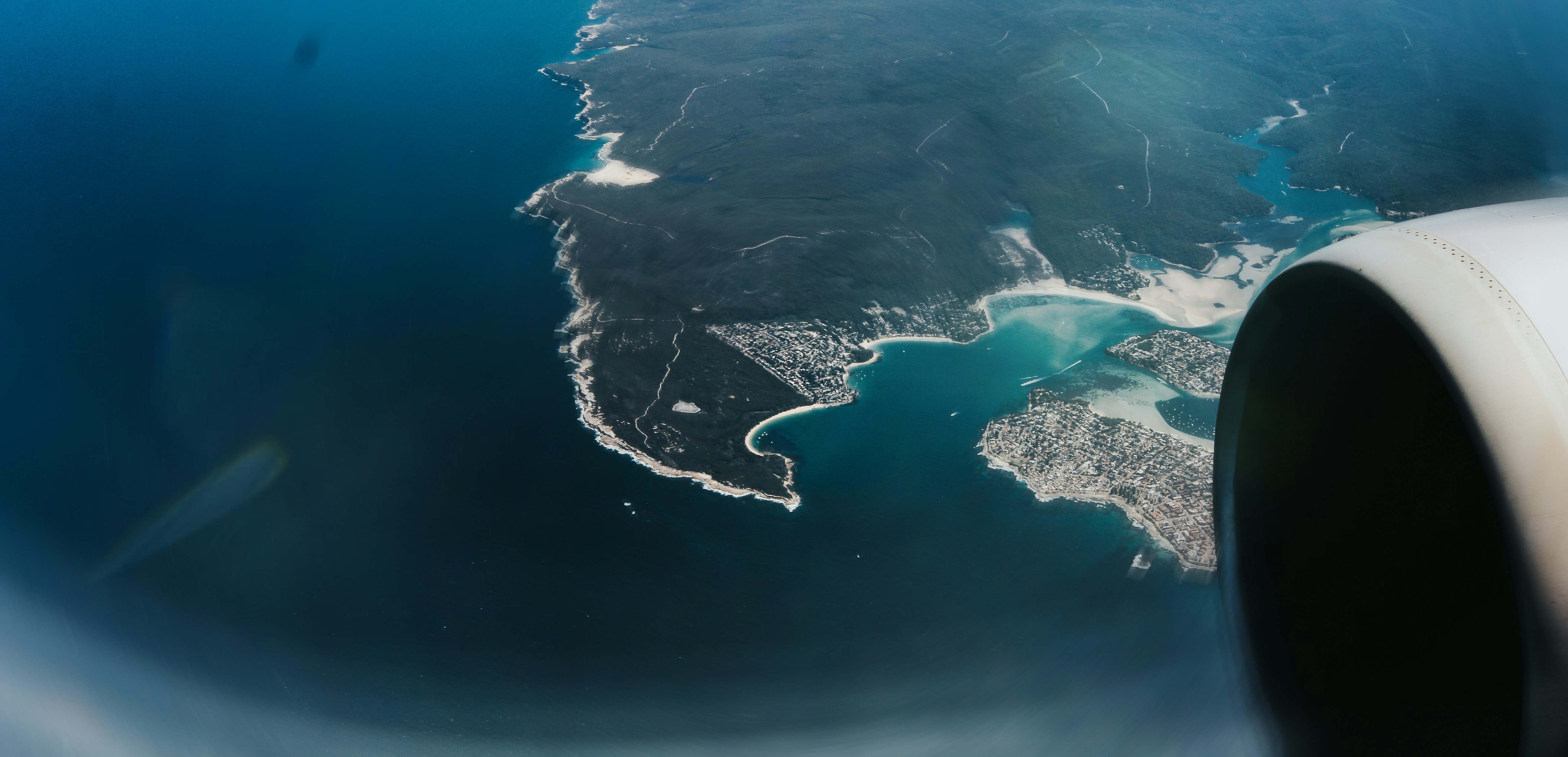 An aerial view of land and ocean.