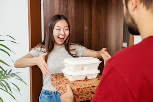 Food delivery makes a woman very happy.
