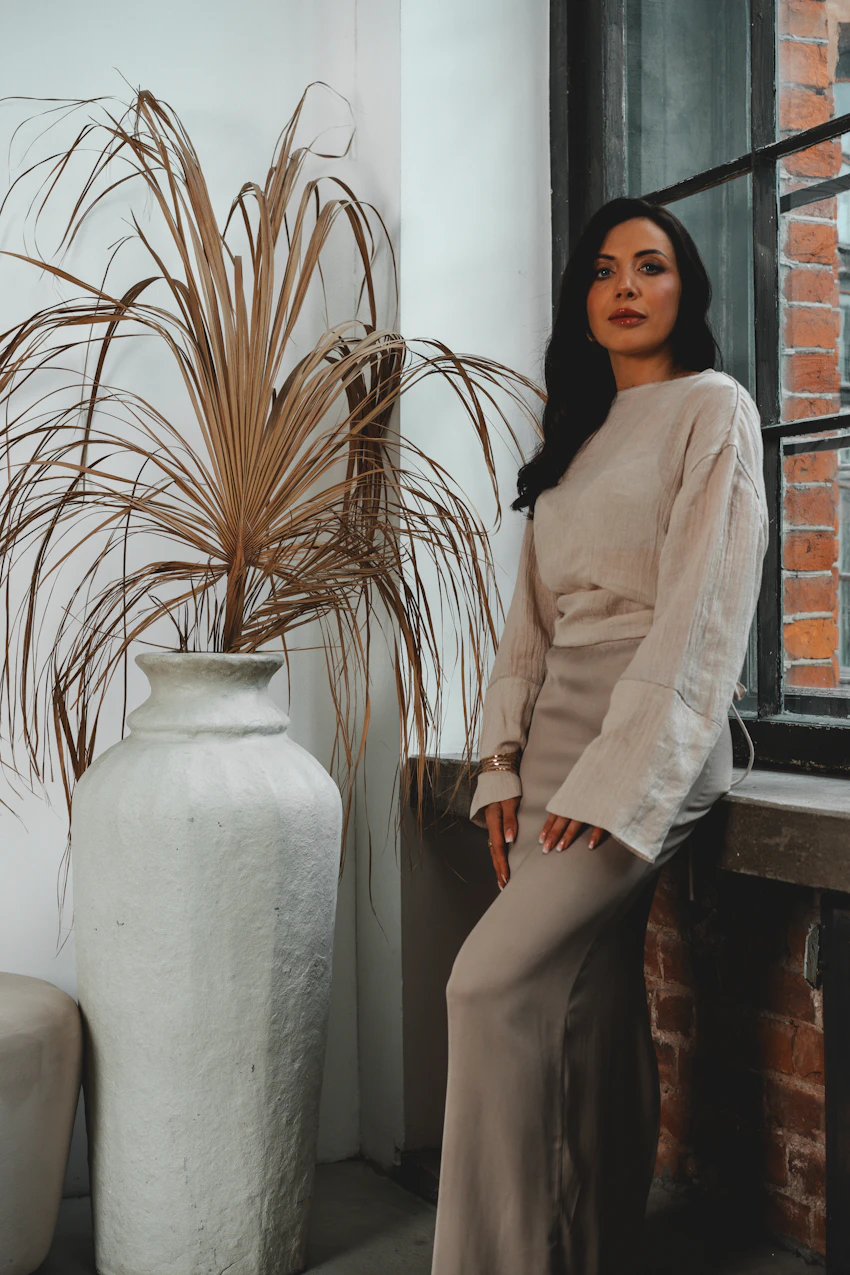 Model wearing a chic neutral-toned ensemble