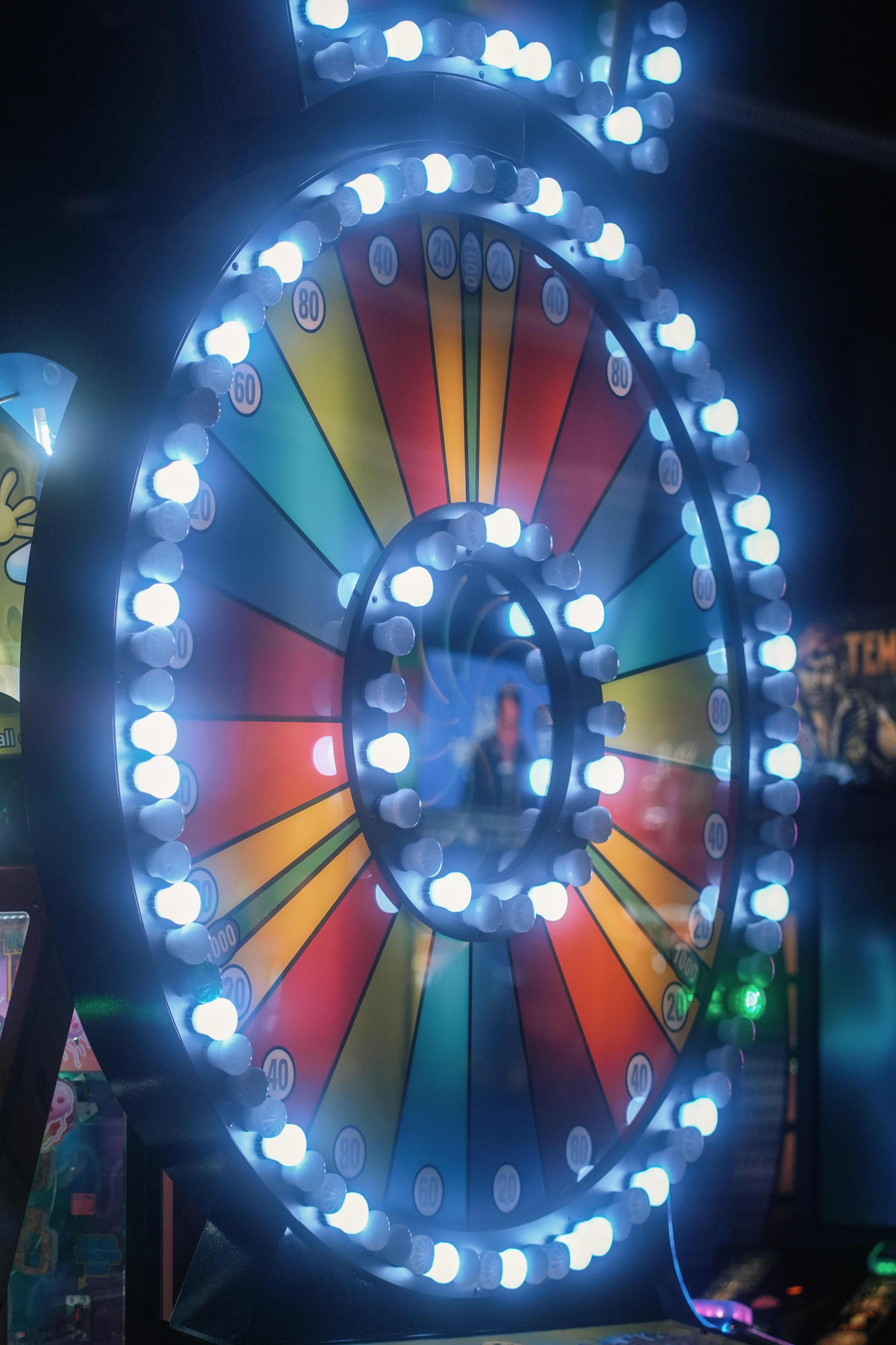 A colorful, illuminated game wheel is spinning. photo – Free Image on ...
